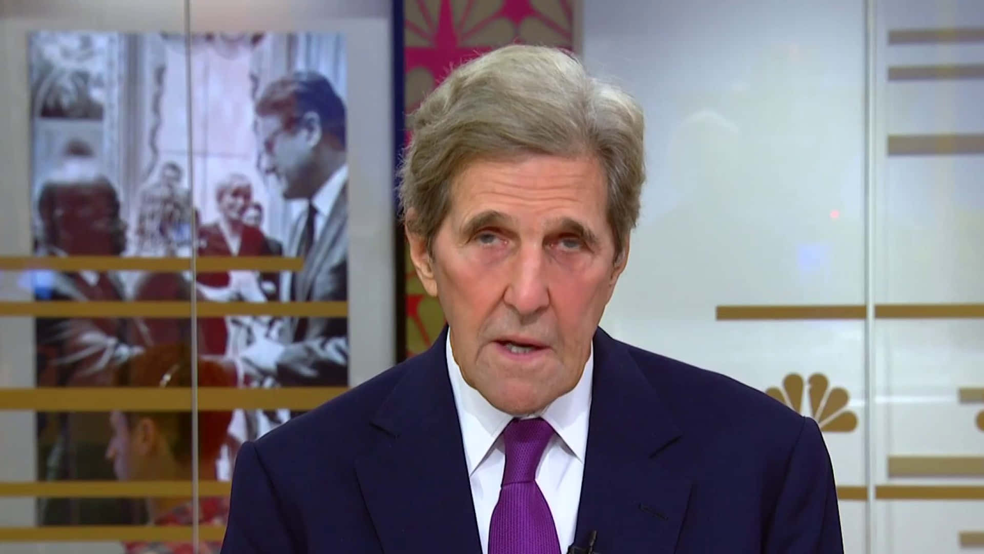 John Kerry Discussing Biden's Climate Policies Wallpaper