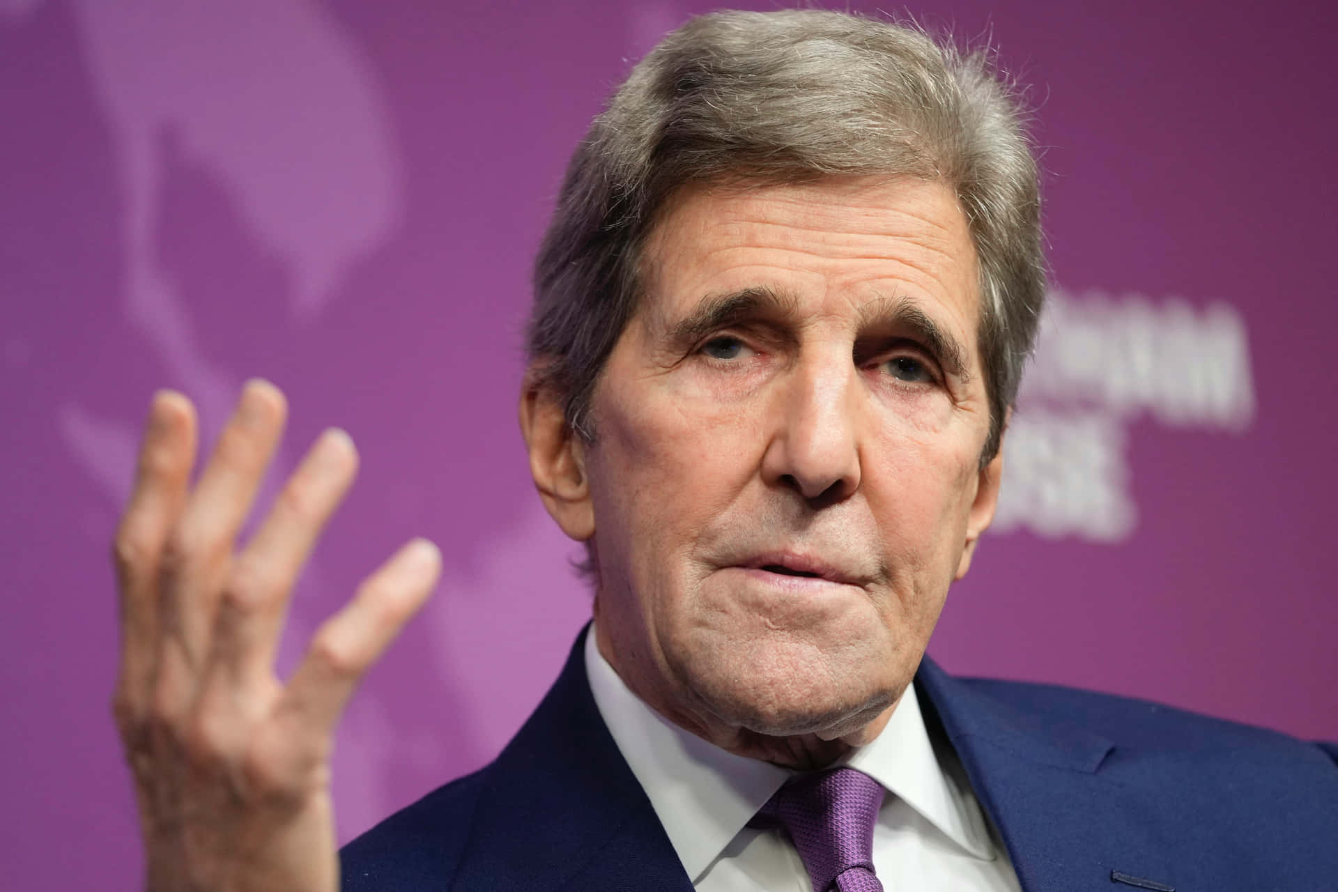 John Kerry With One Hand Up Wallpaper