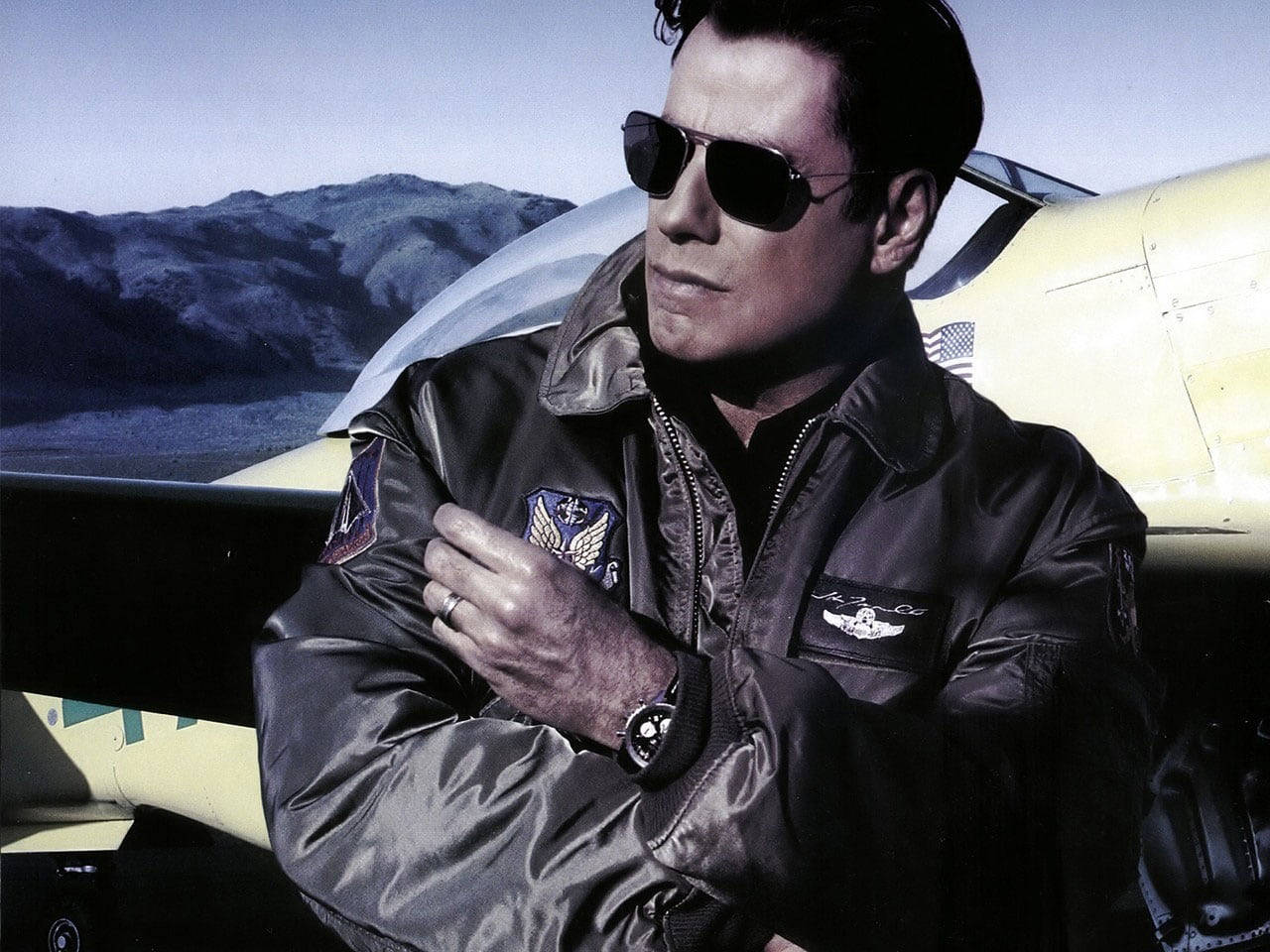 Caption: Dynamic John Travolta in Broken Arrow Movie Wallpaper