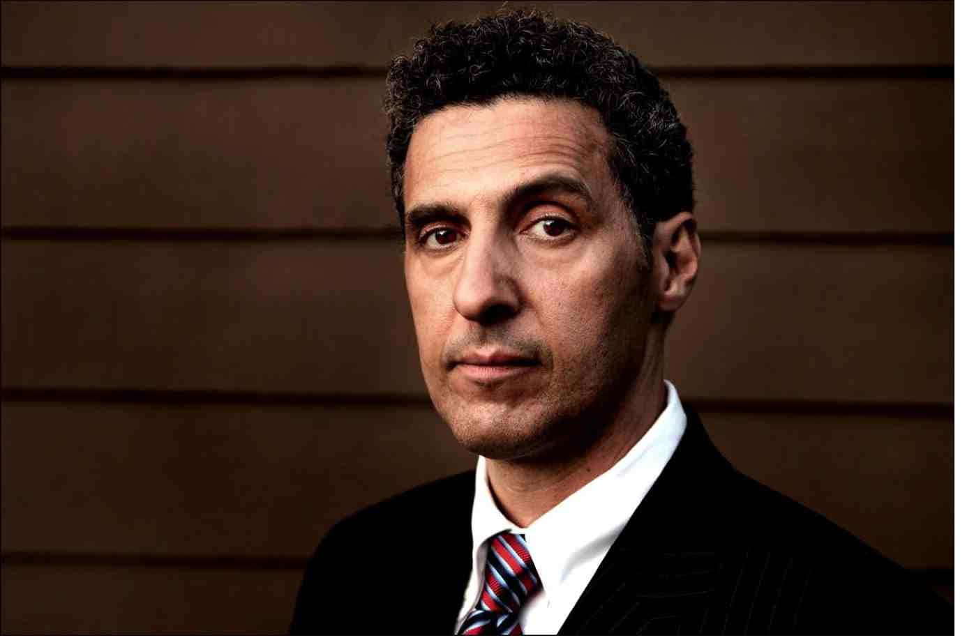 The charismatic actor, John Turturro, sporting a charming smile Wallpaper