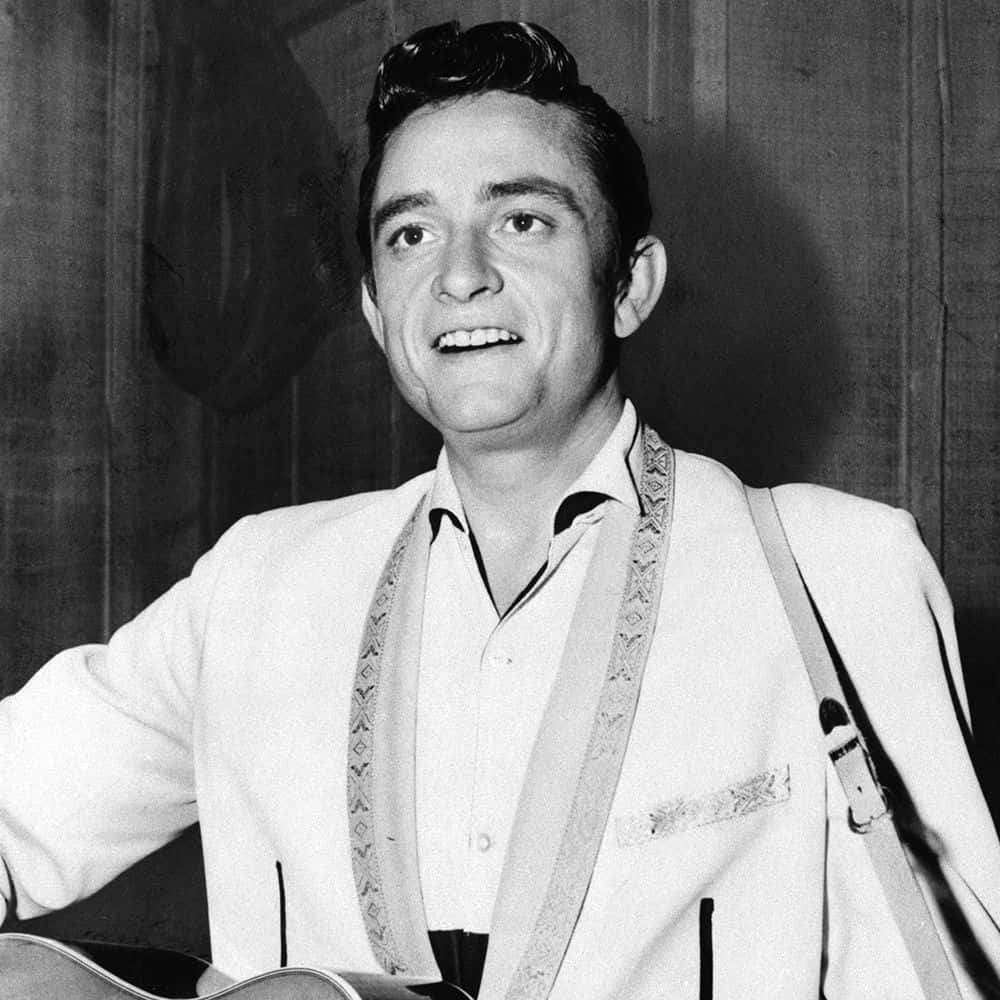 Johnny Cash - A Man Holding An Acoustic Guitar