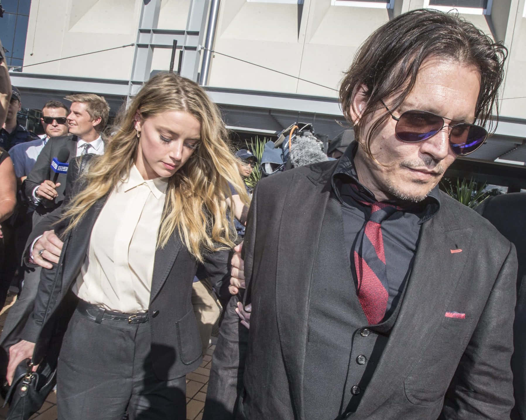 "Johnny Depp and Amber Heard on the red carpet of their movie premiere".