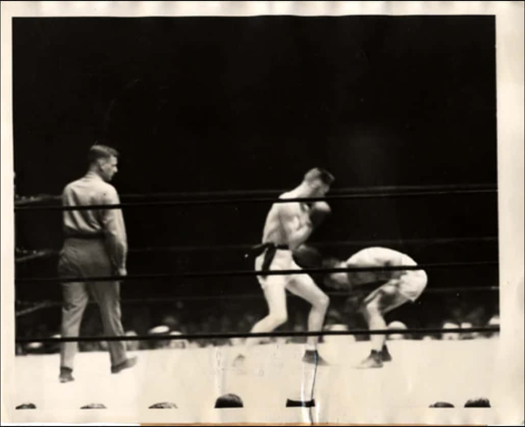 Johnny Dundee Bending Down At The Fight Wallpaper