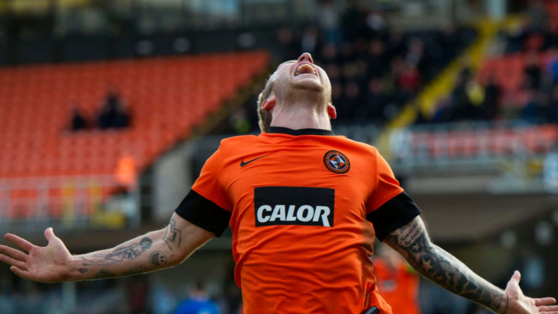 Johnny Russell i Dundee United Football Club Jersey tapet. Wallpaper
