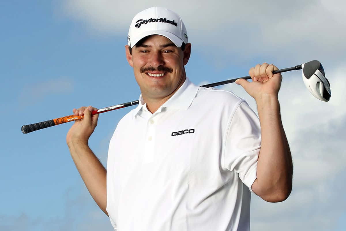 Caption: Professional Golfer Johnson Wagner Posing with Club on Shoulder Wallpaper