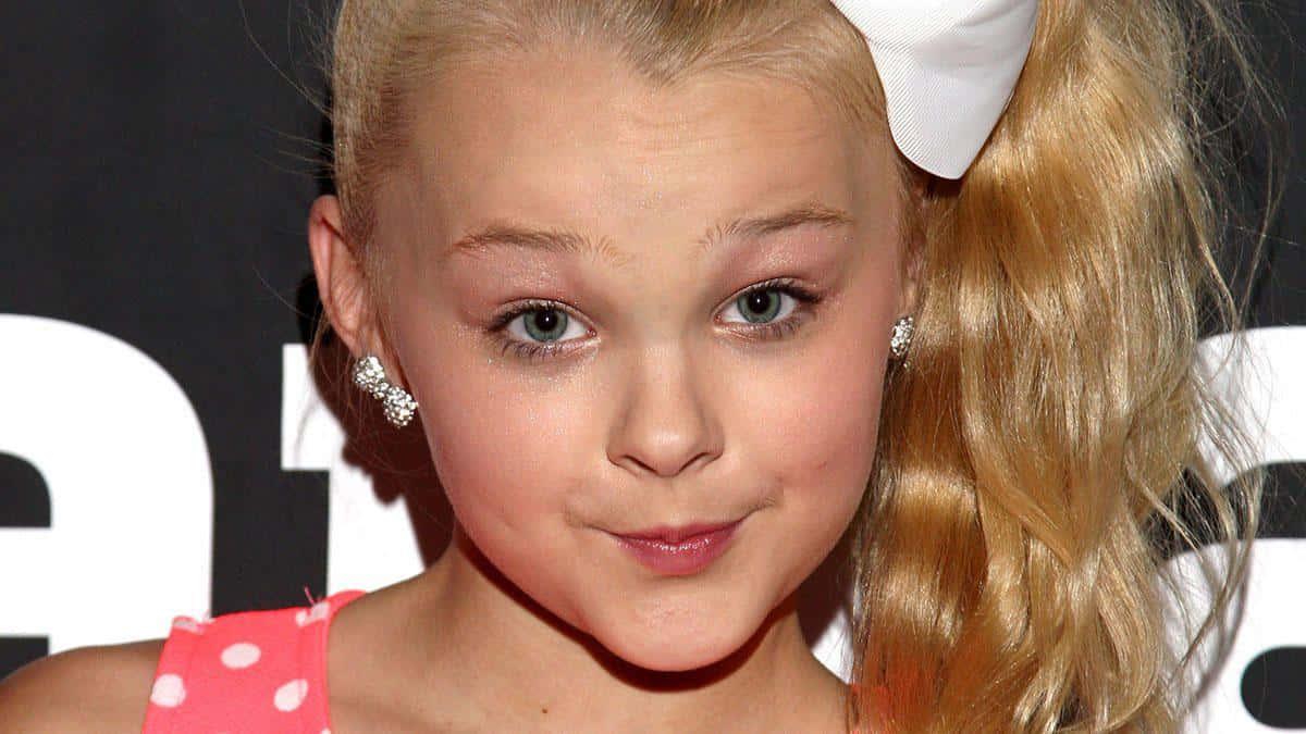 Jojo Siwa Stands Confidently in a Sparkle Outfit