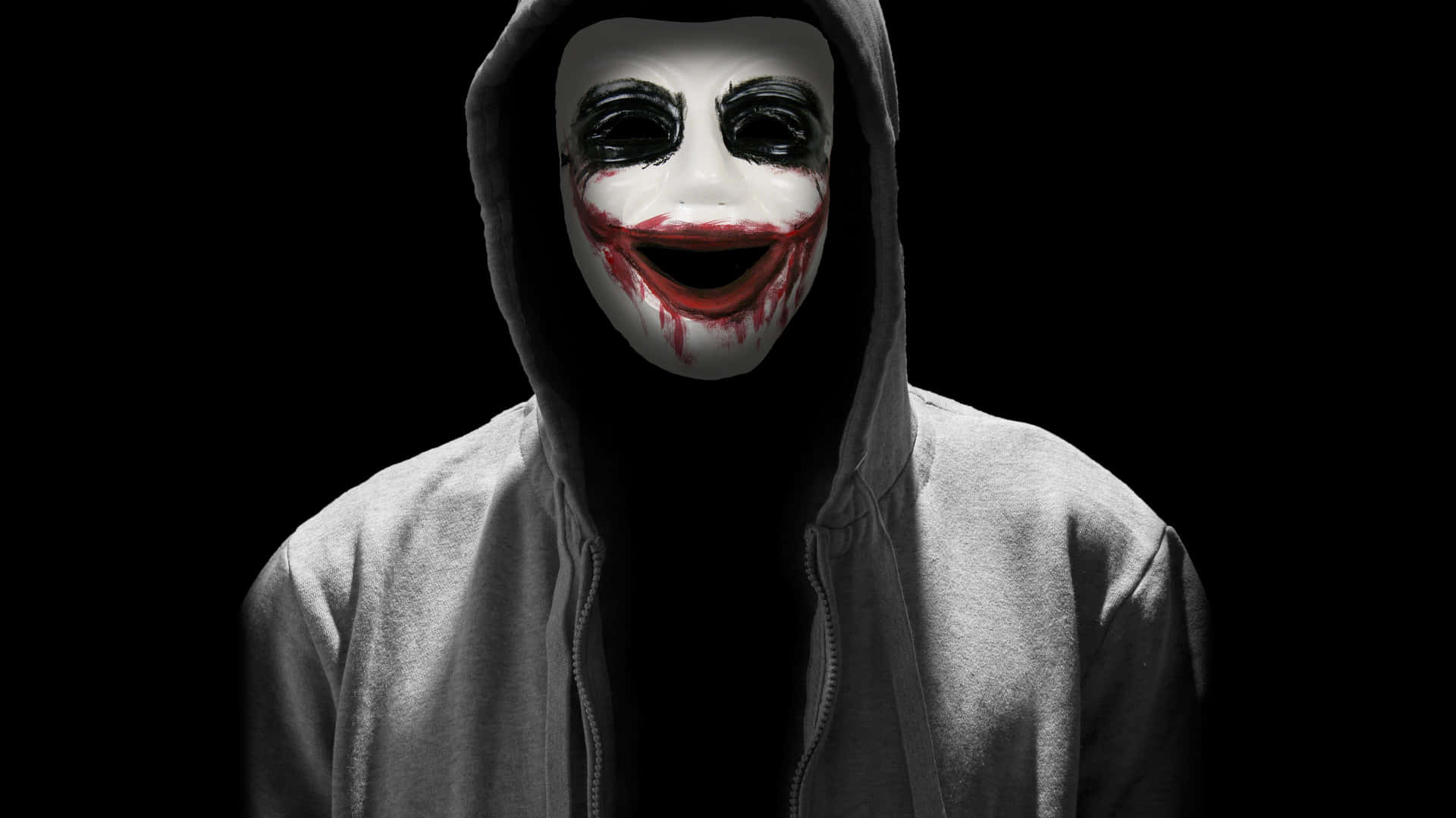 Einmann Trägt Eine Joker-maske Mit Blut Im Gesicht.