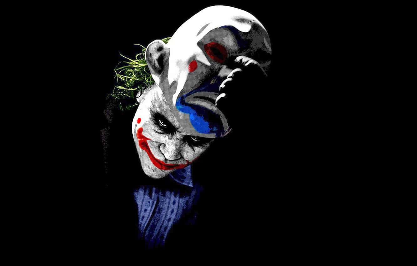 Download An Eerie Image of a Man Wearing a Joker Mask | Wallpapers.com
