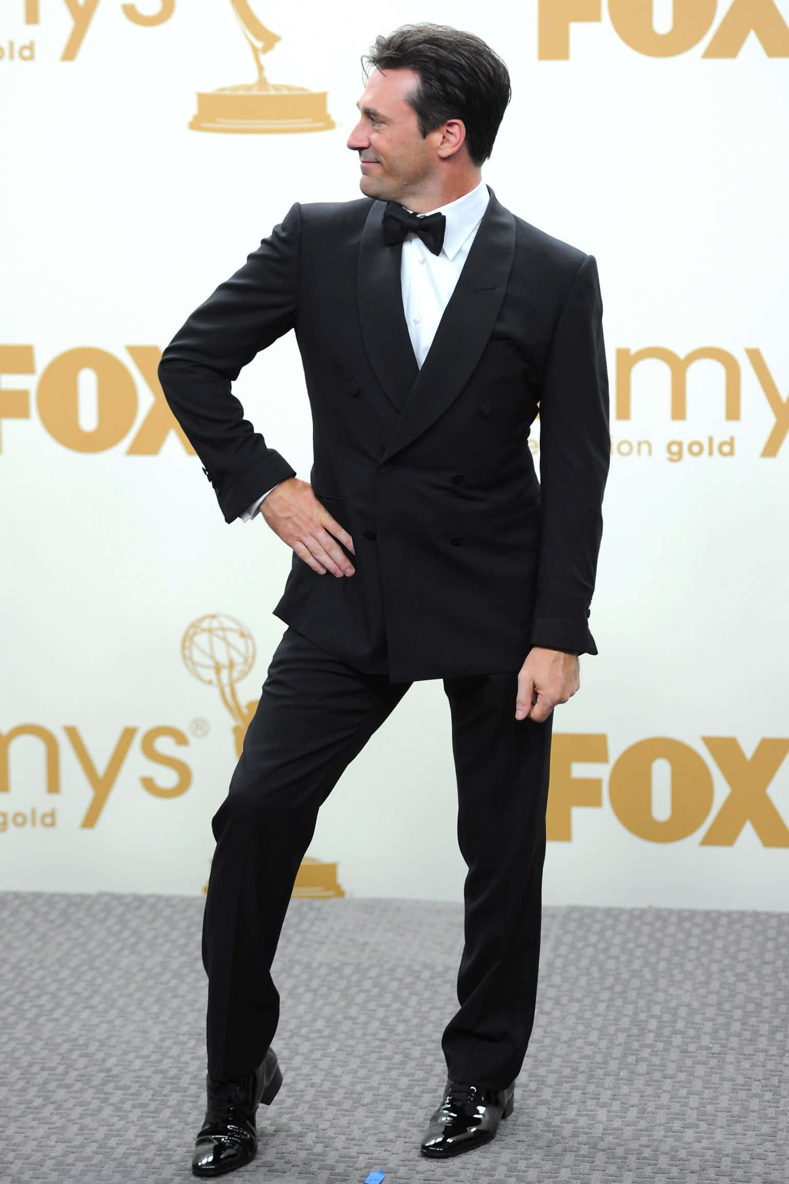 Jon Hamm Radiating Poise in a Classic Suit Wallpaper