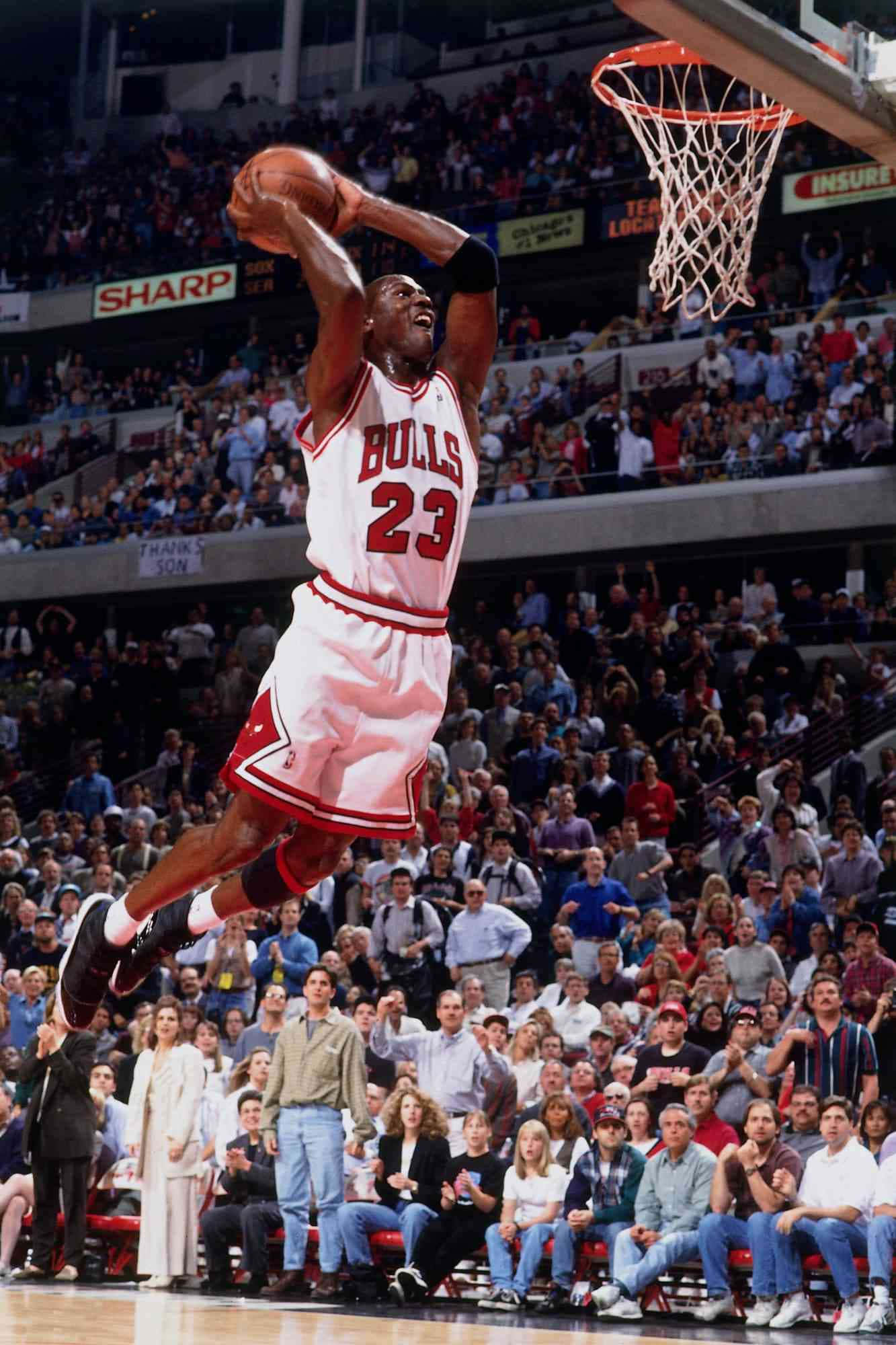 Action-packed shot of Michael Jordan mid-air during a basketball game