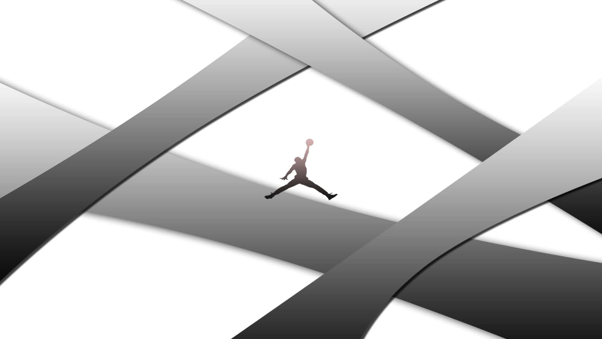 A Man Is Jumping In The Air With A Black And White Background Wallpaper