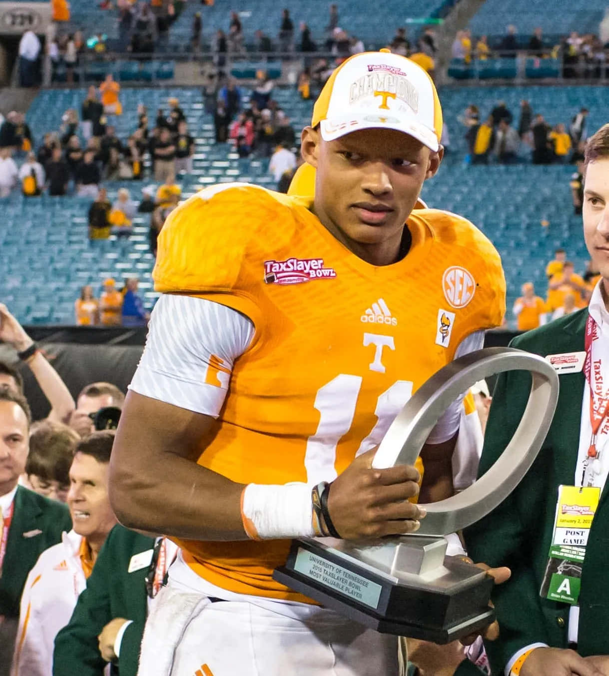 Joshua Dobbs Holding Trophy After Game Wallpaper