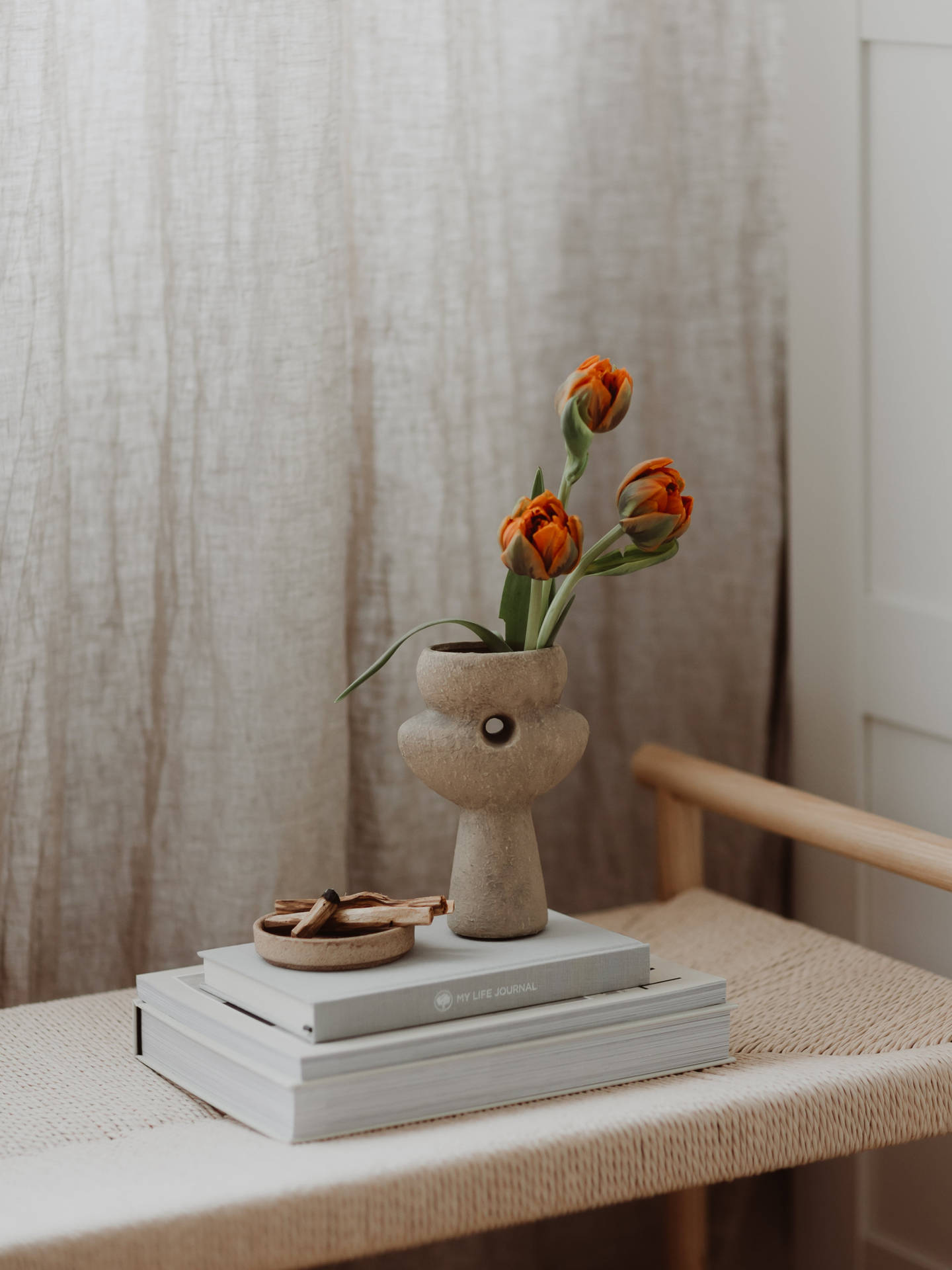 Journals And Flower Vase Wallpaper