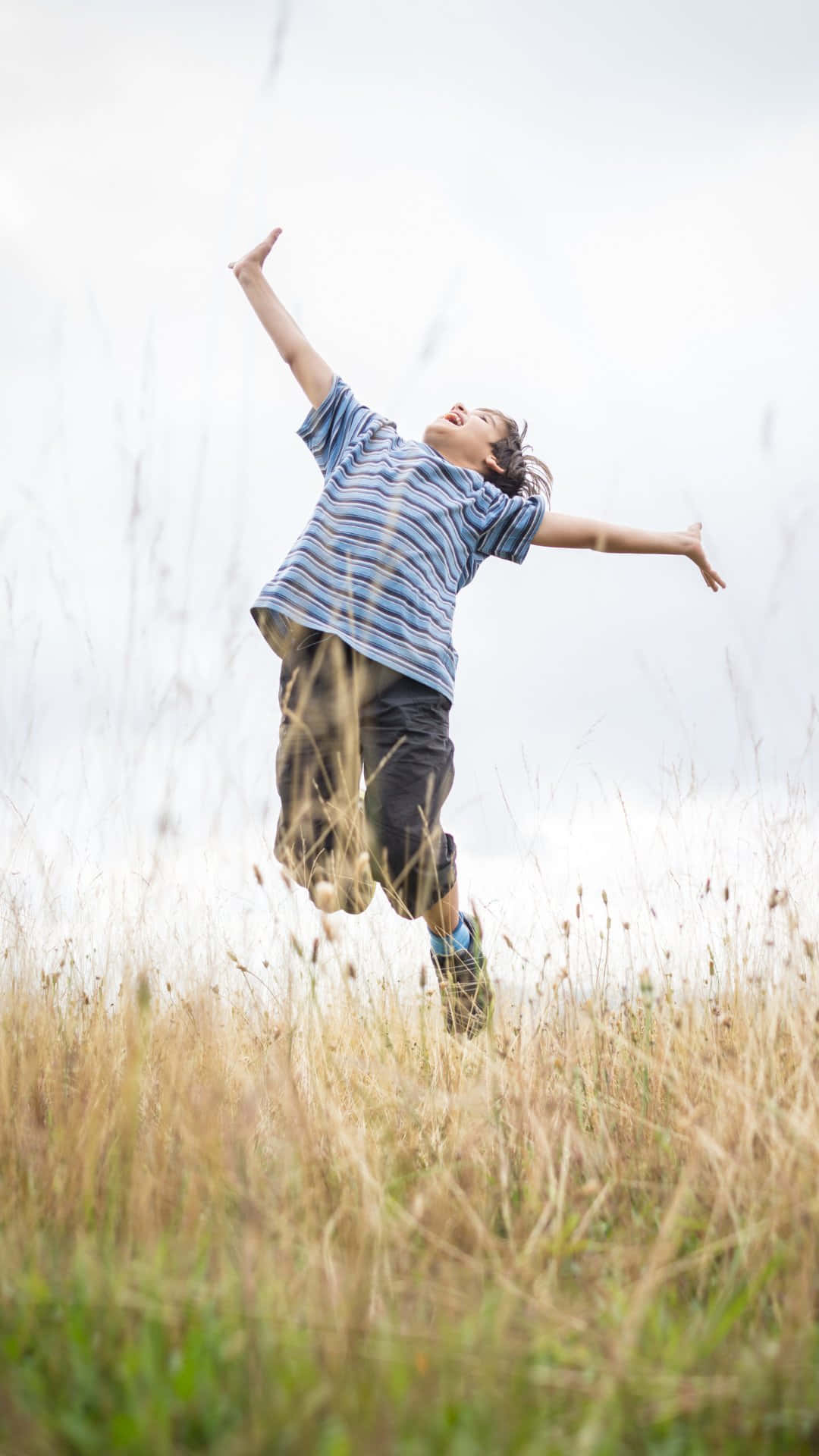 Joyful Boyin Field Wallpaper