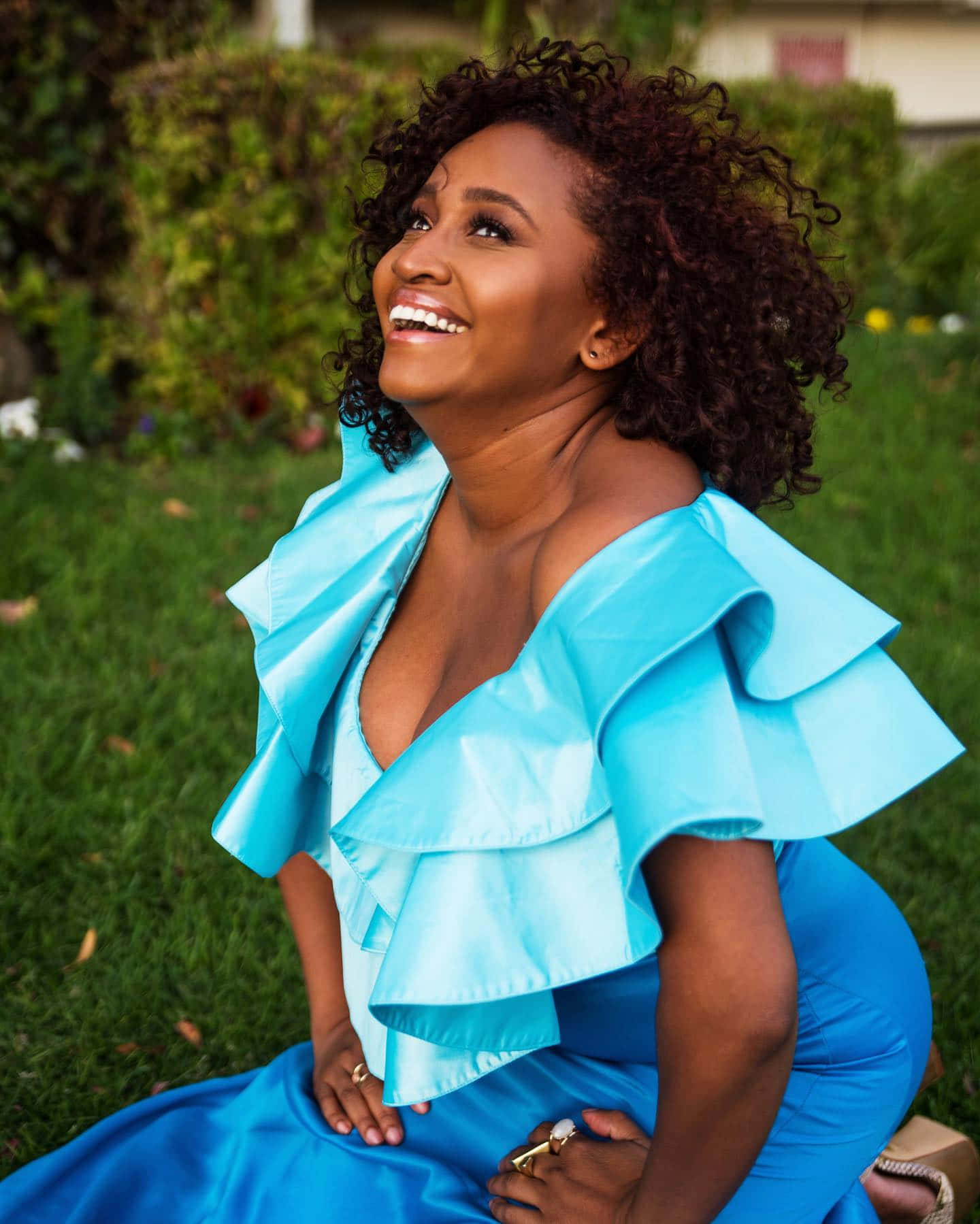 Joyful Womanin Blue Dress Outdoors Wallpaper