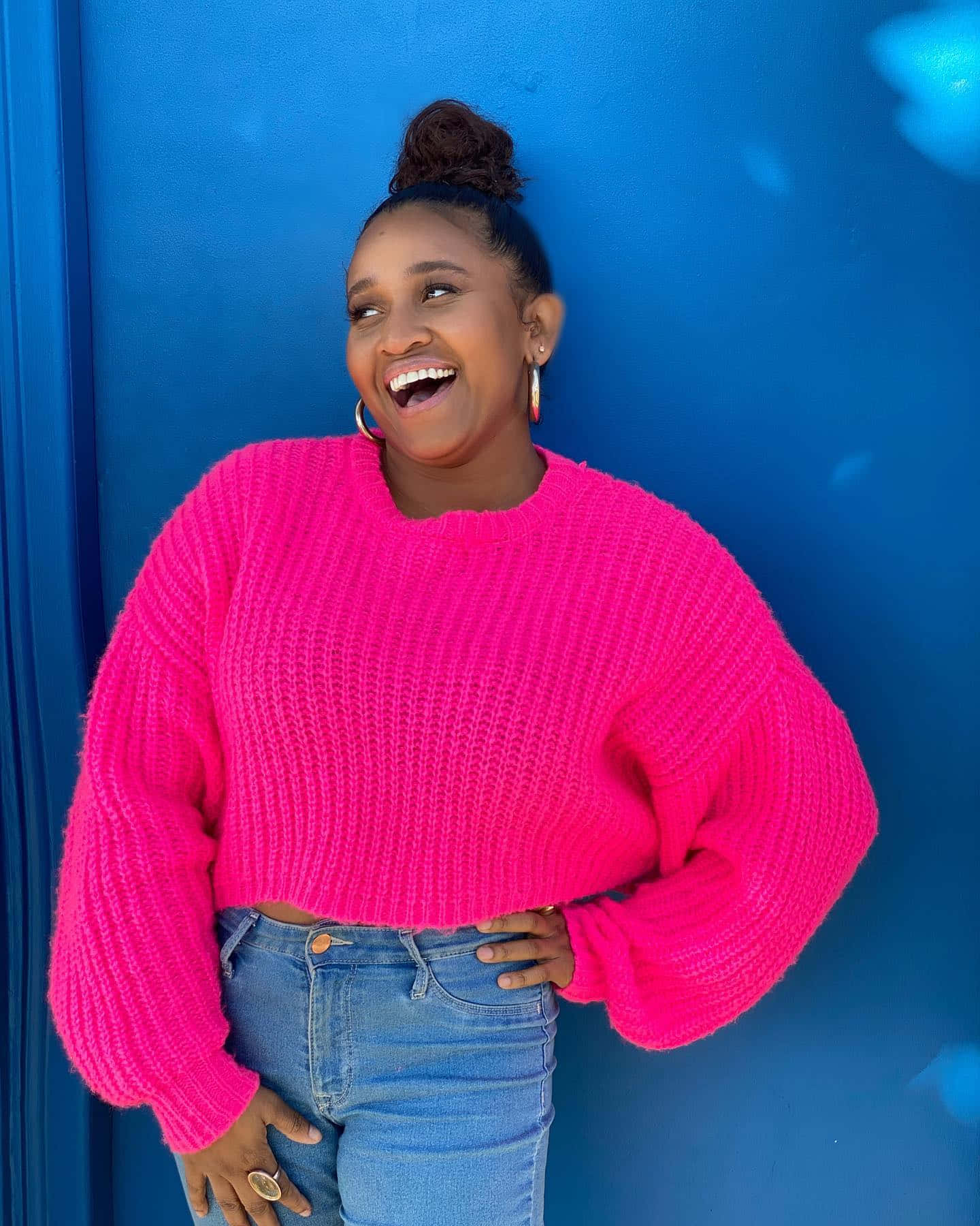 Joyful Womanin Pink Sweater Wallpaper