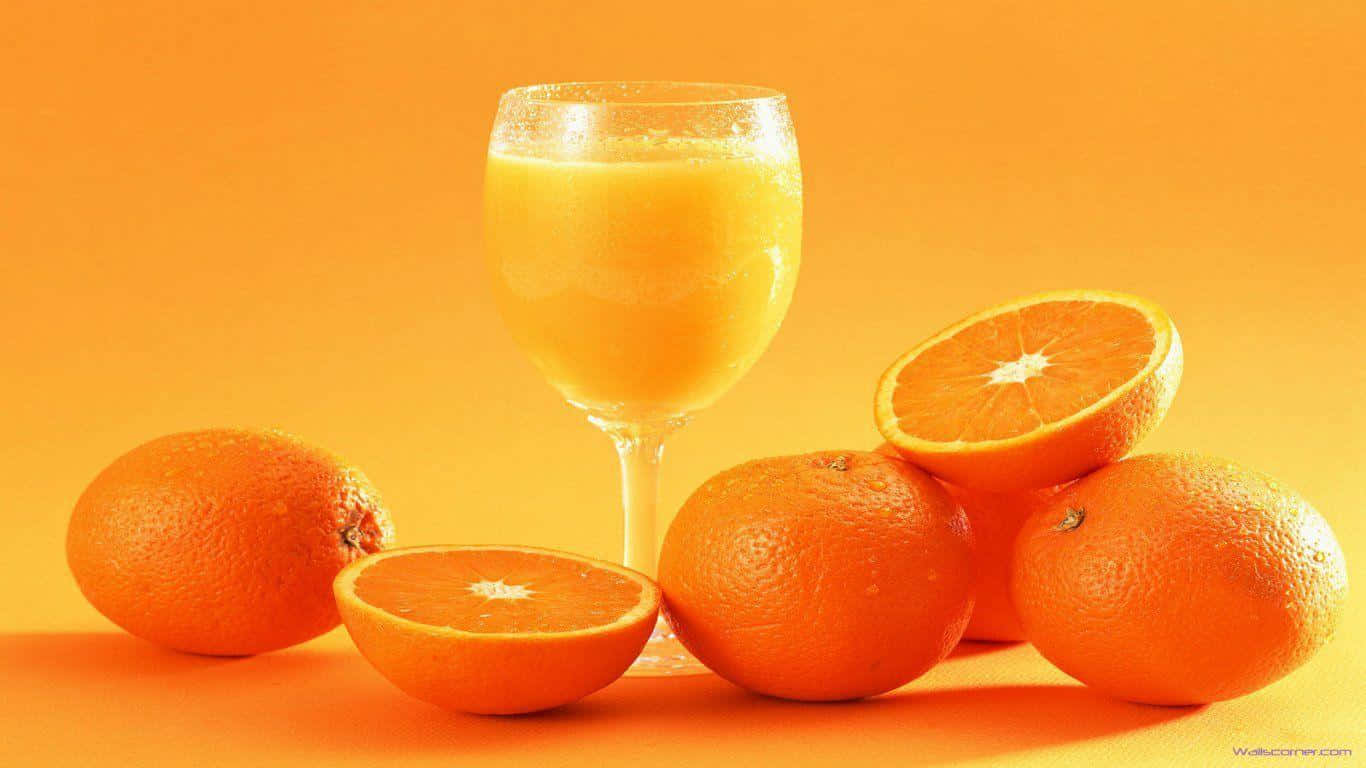 Juice Served With Orange Slices Wallpaper