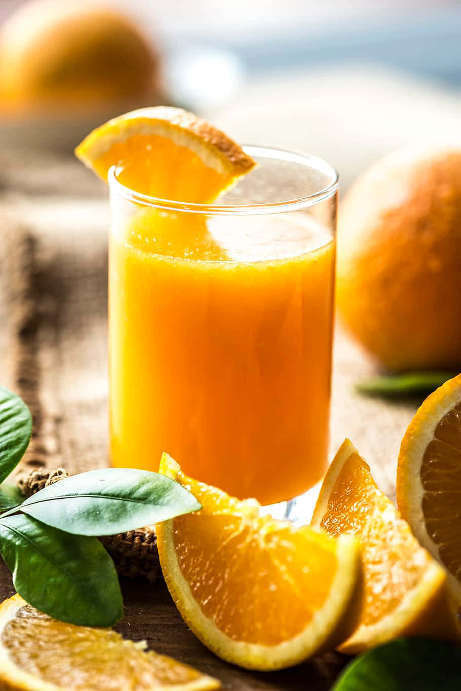 Juice With Fresh Orange Wedges Wallpaper