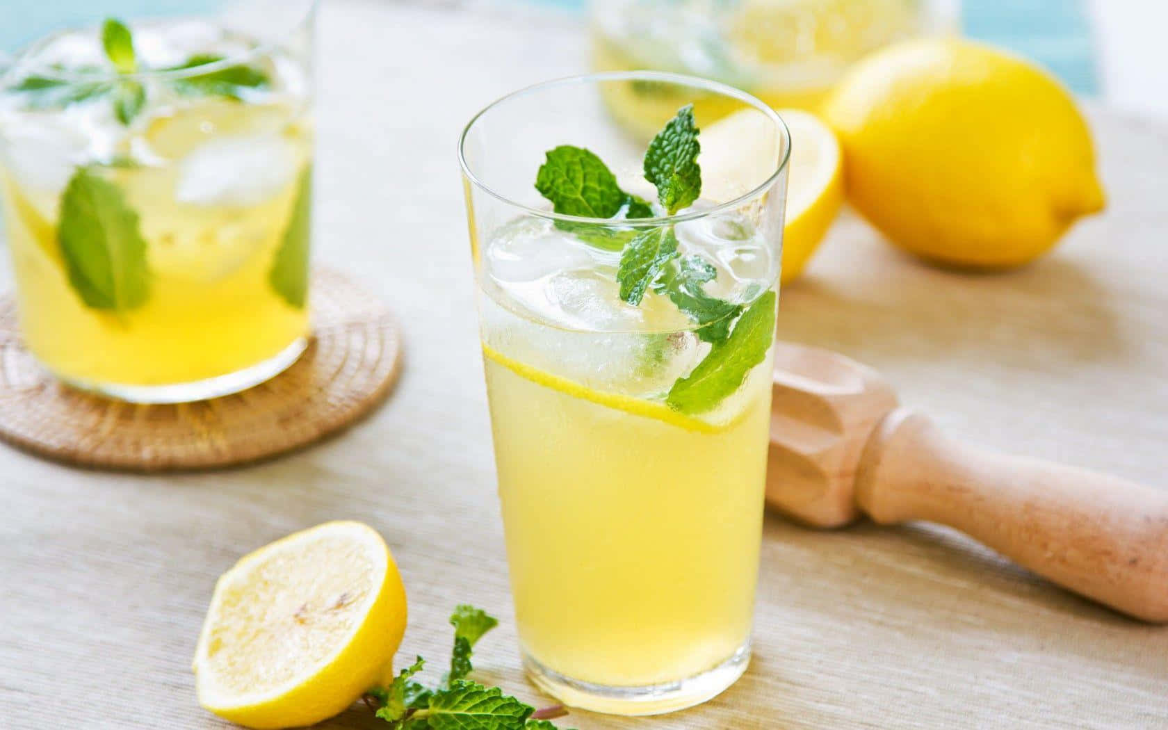 Juice With Lemons And Mint Leaves Wallpaper