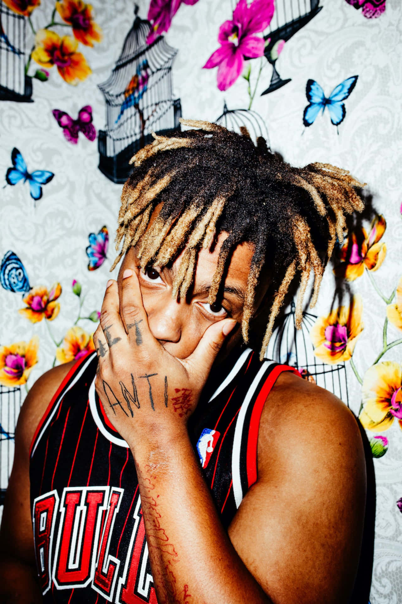Download Juice Wrld Surrounded by His Artwork Wallpaper