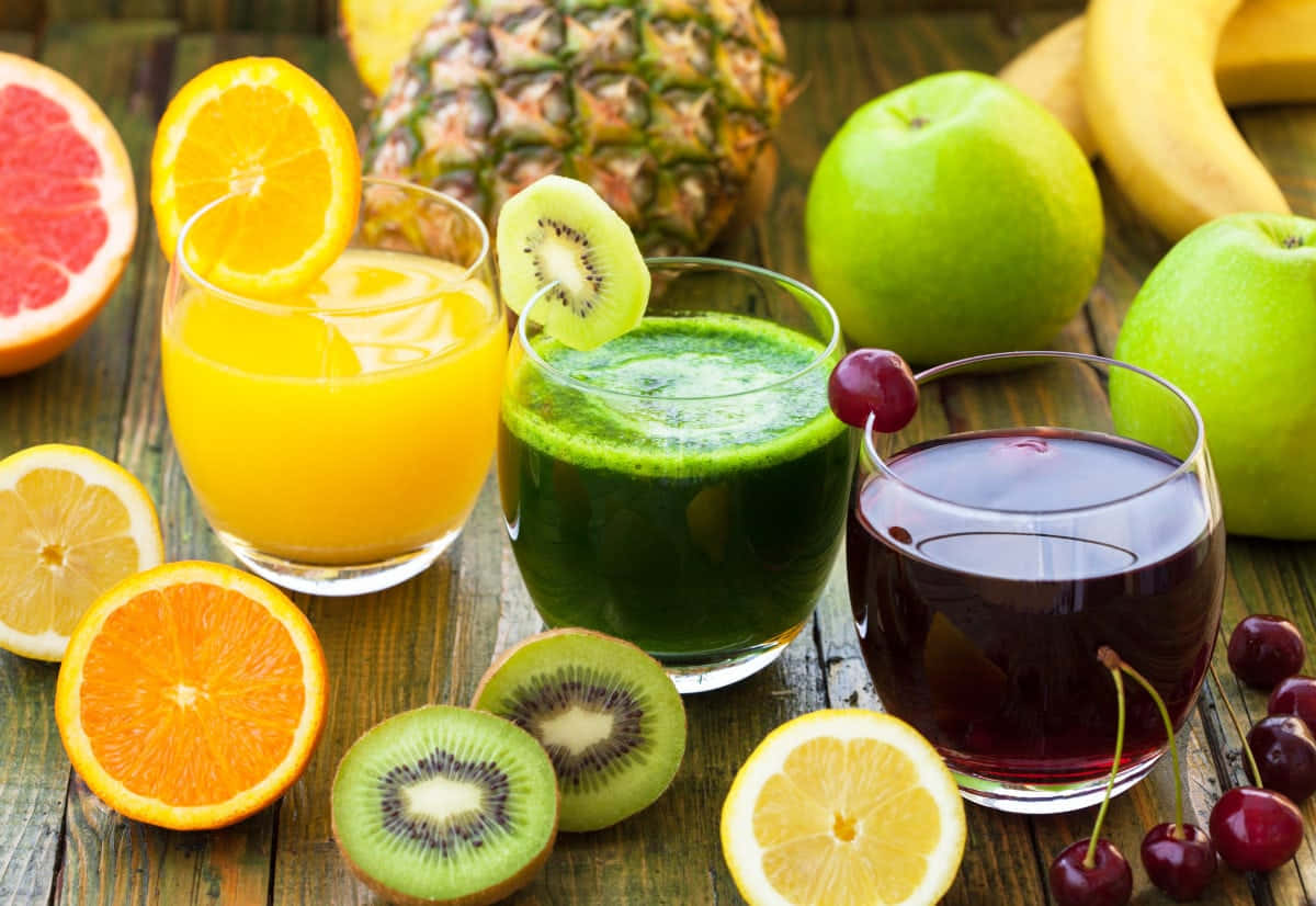 Juices With Kiwi Orange And Grape Wallpaper