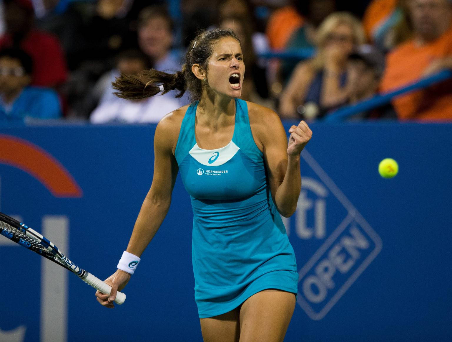 Julia Goerges celebrating with a fist pump after a victory Wallpaper