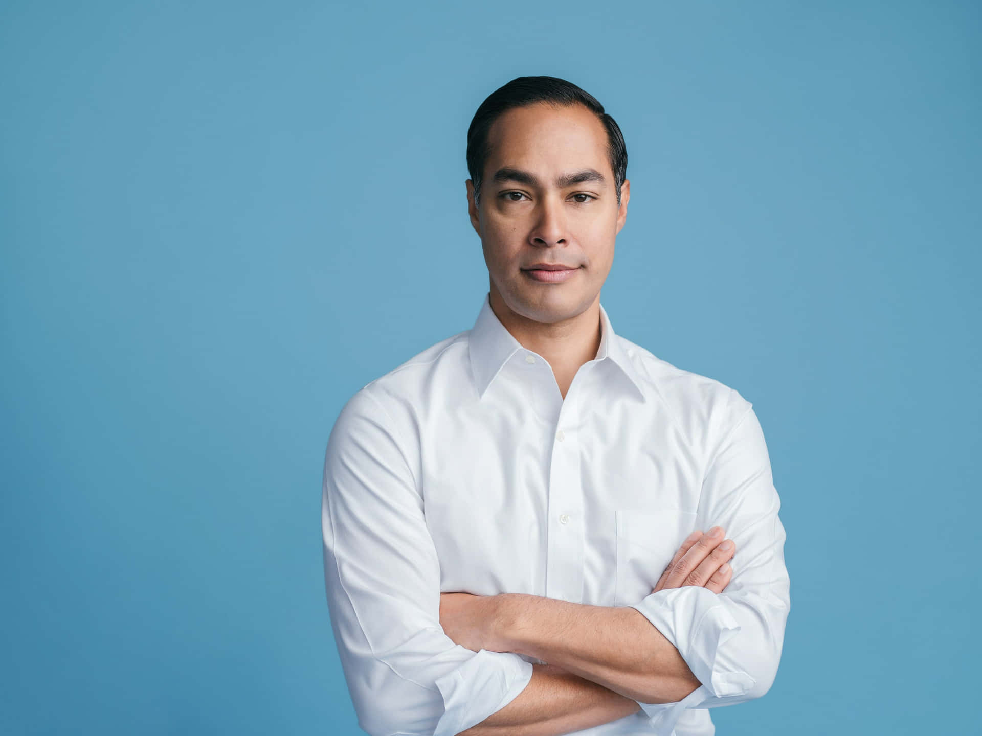 Julian Castro With Blue Background Wallpaper
