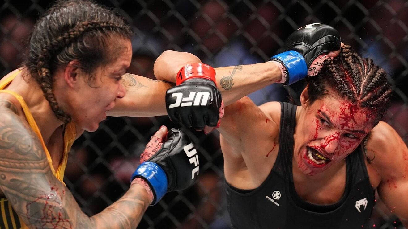 Julianna Peña during a fierce UFC fight Wallpaper