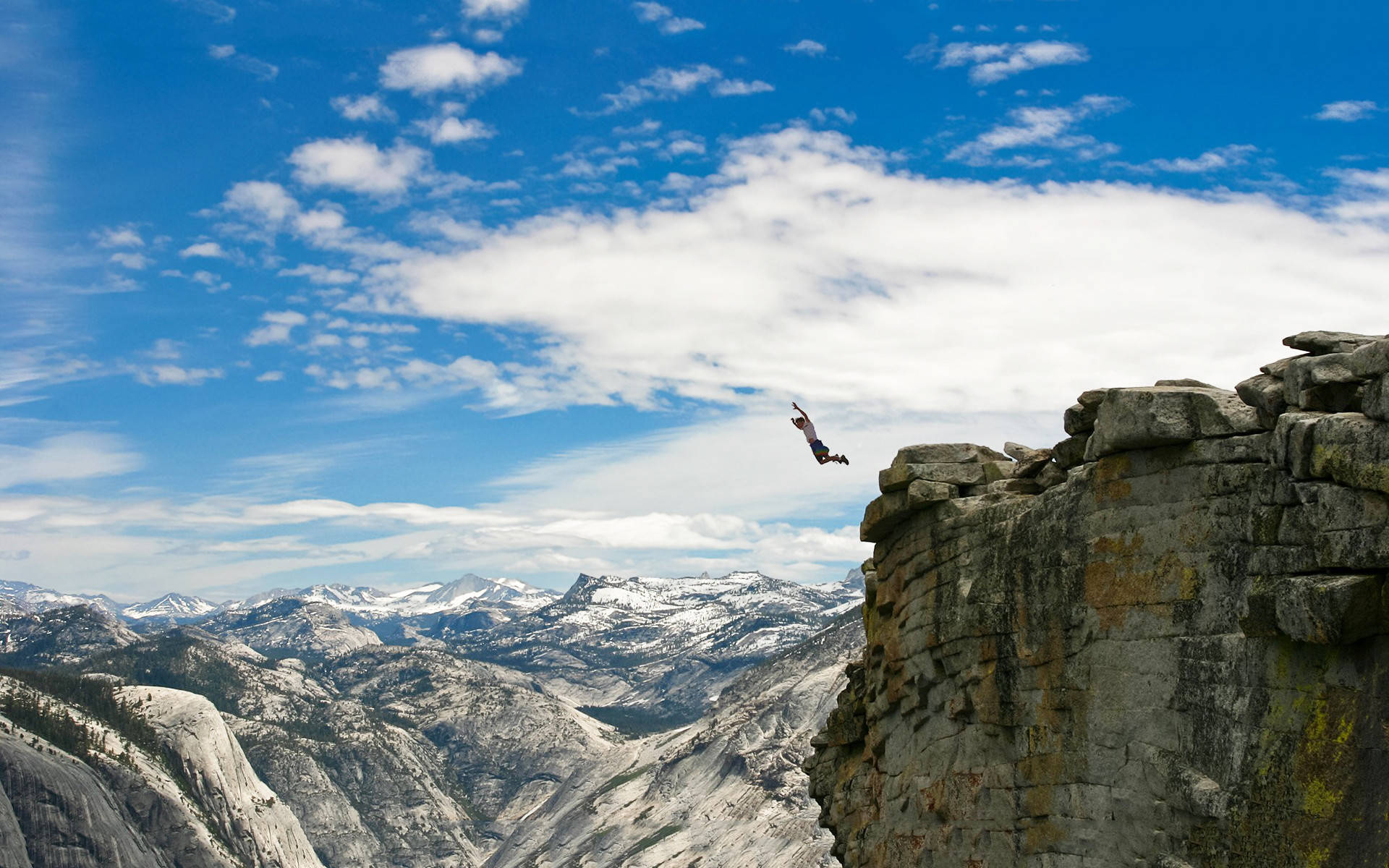 Jumping From A Mountain Structure Wallpaper