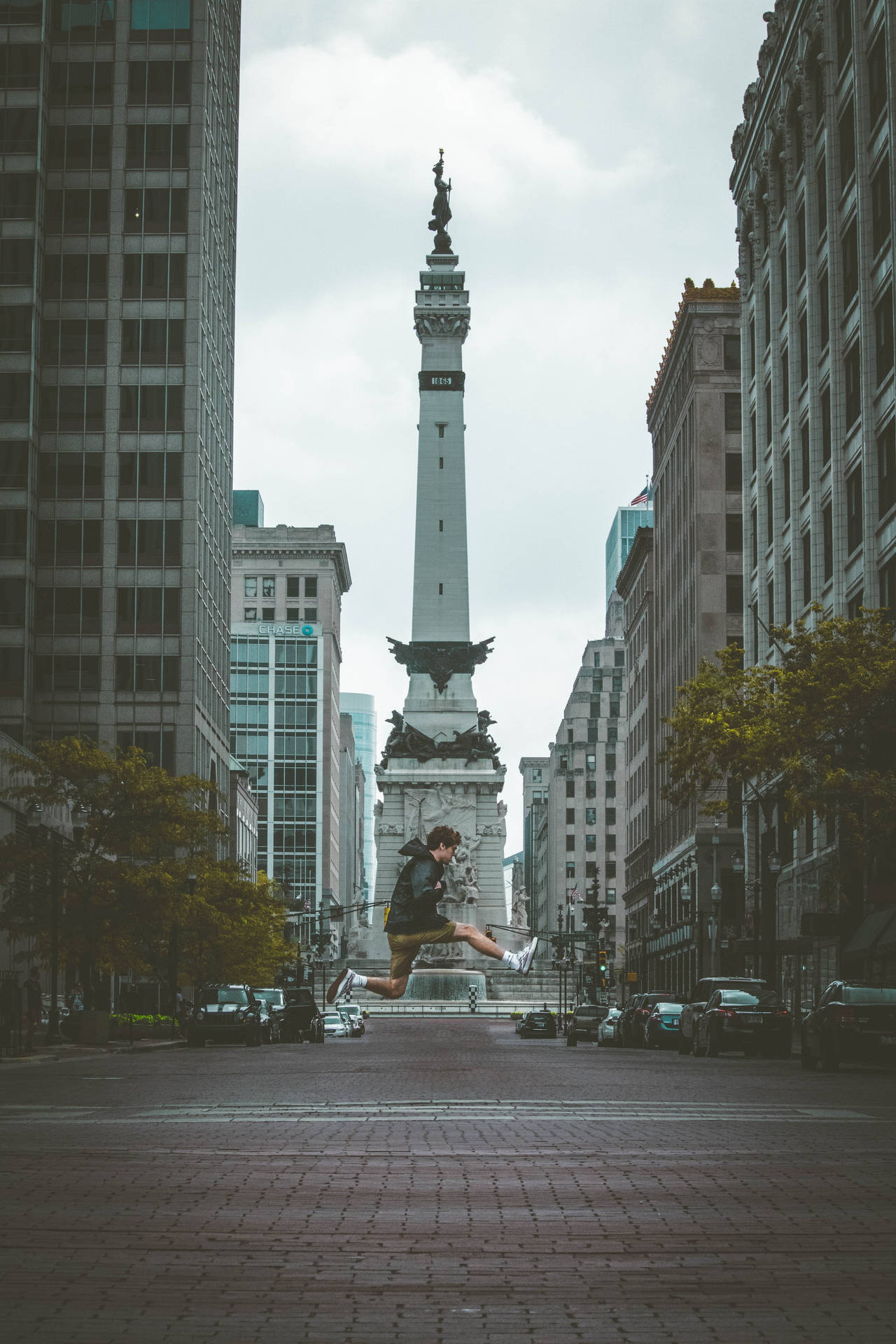Jumping Front Of Indianapolis Monument Wallpaper