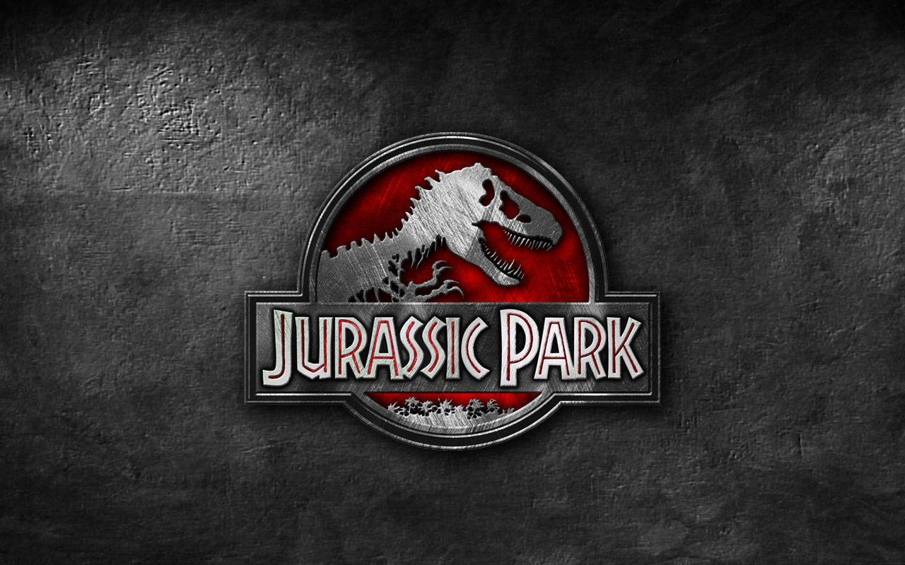 Jurassic Park Logo In Gray Hue Wallpaper