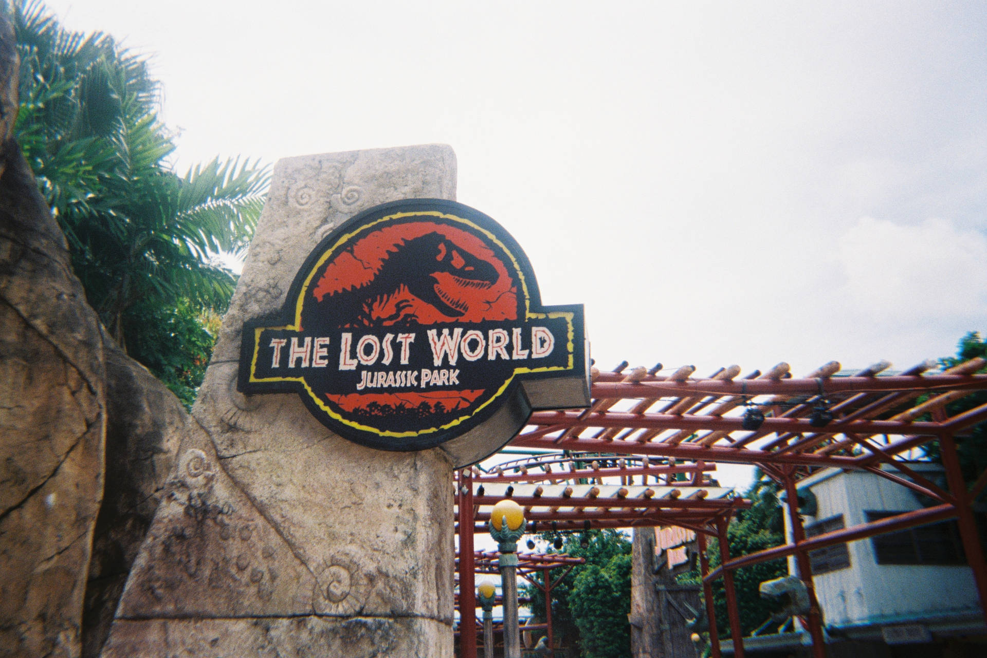 Jurassic World Logo In Town Wallpaper