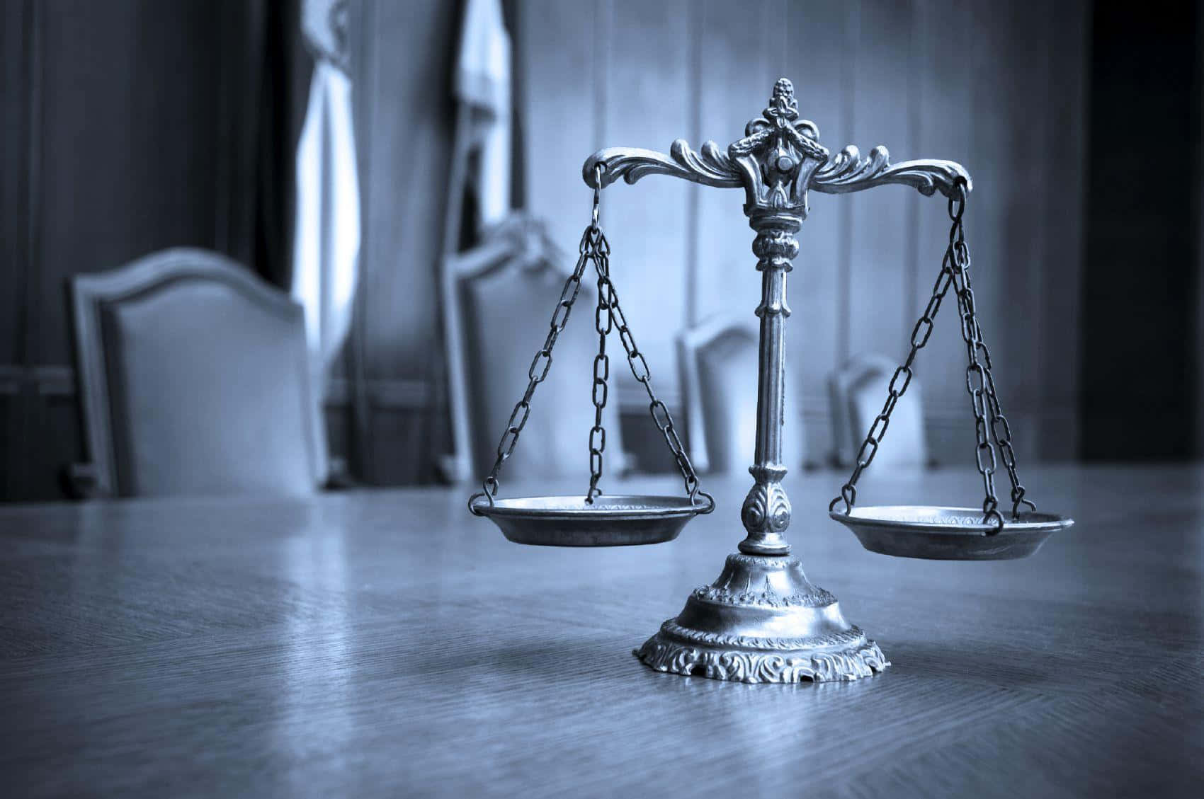 A Scale Of Justice On A Table