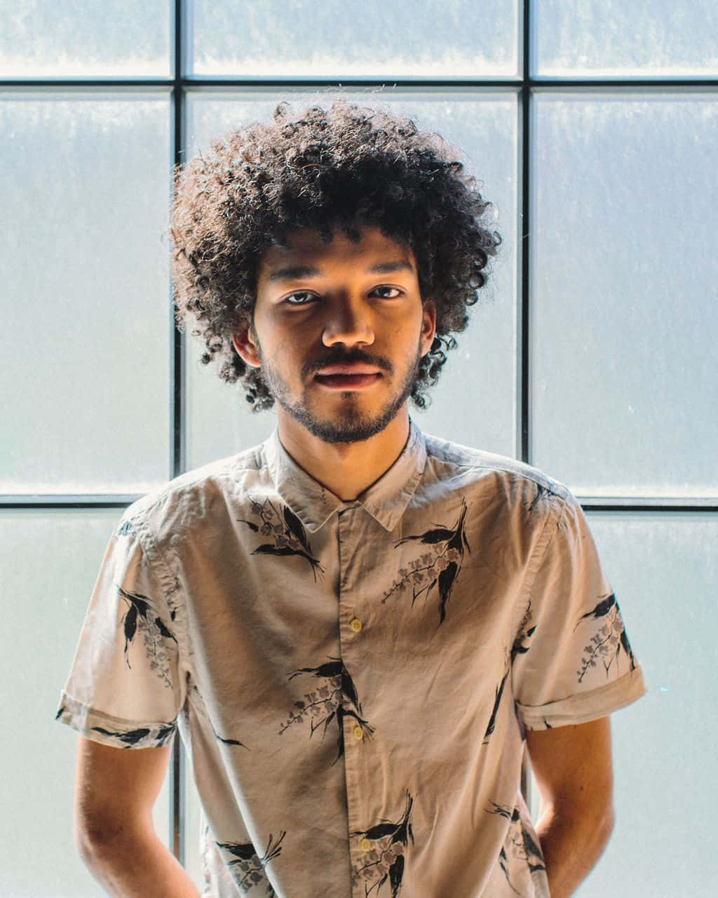 Justice Smith Exuding Confidence In A Casual Attire Wallpaper