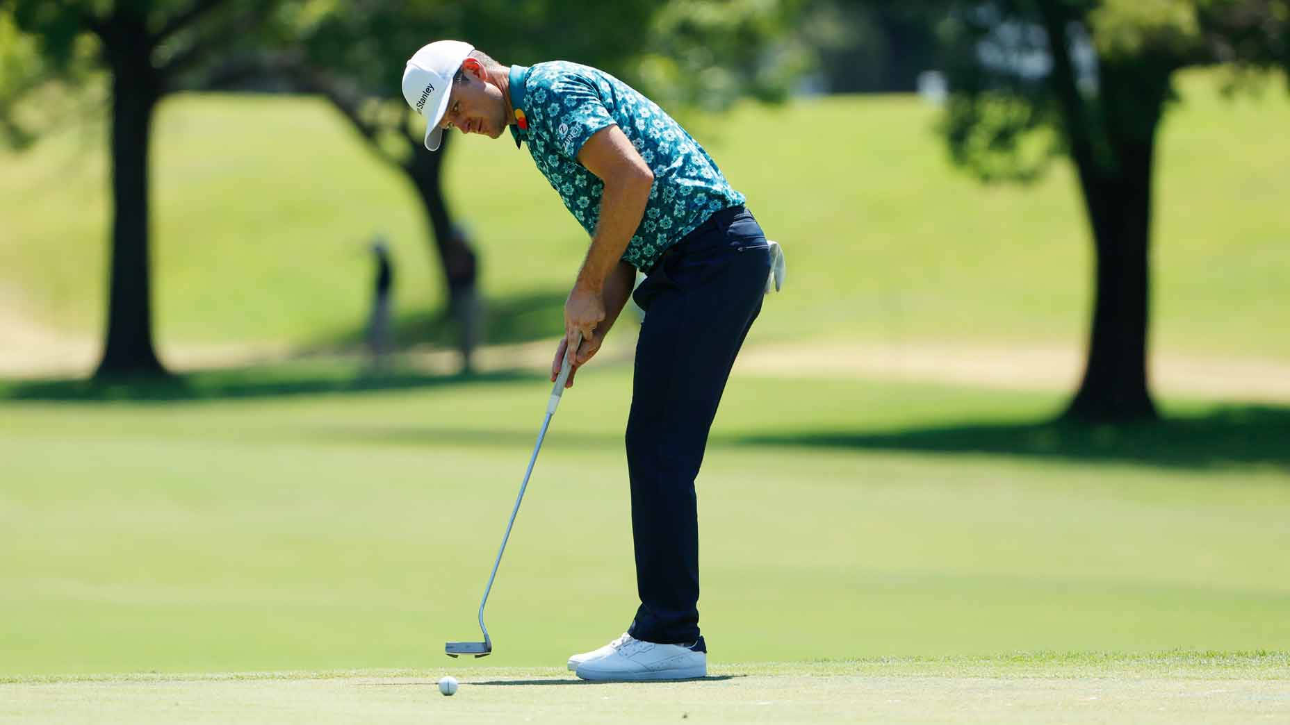 Justin Rose Attempting To Hit A Putt Wallpaper
