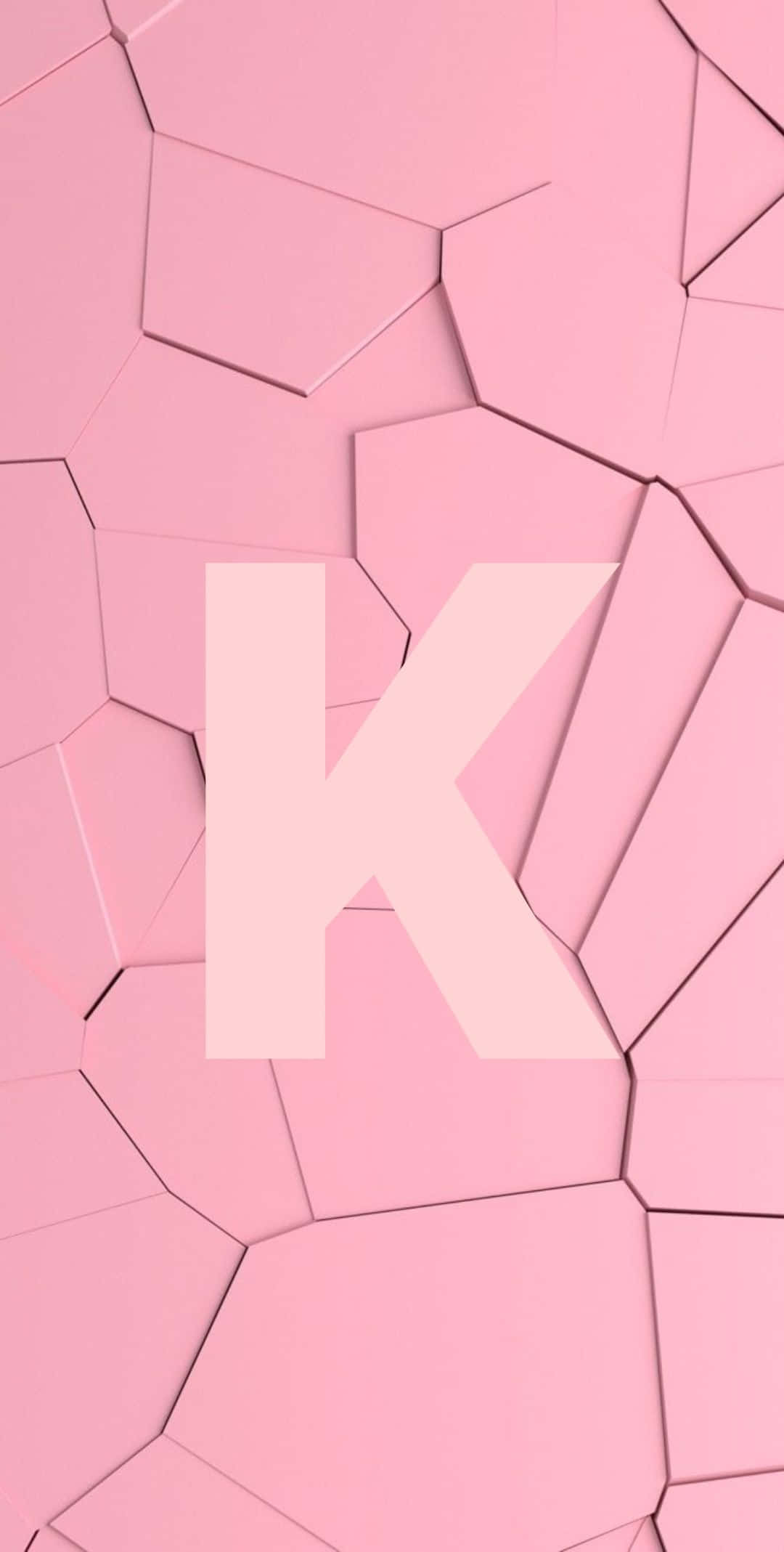 A Pink Background With The Letter K On It