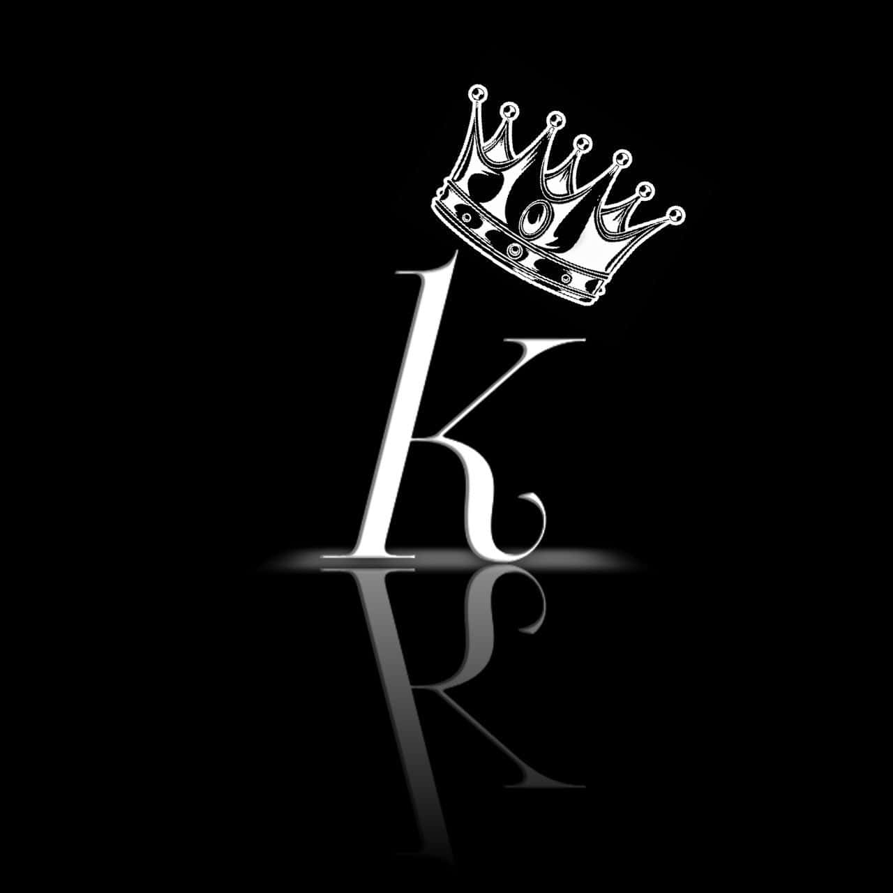 A Black And White Logo With A Crown On It