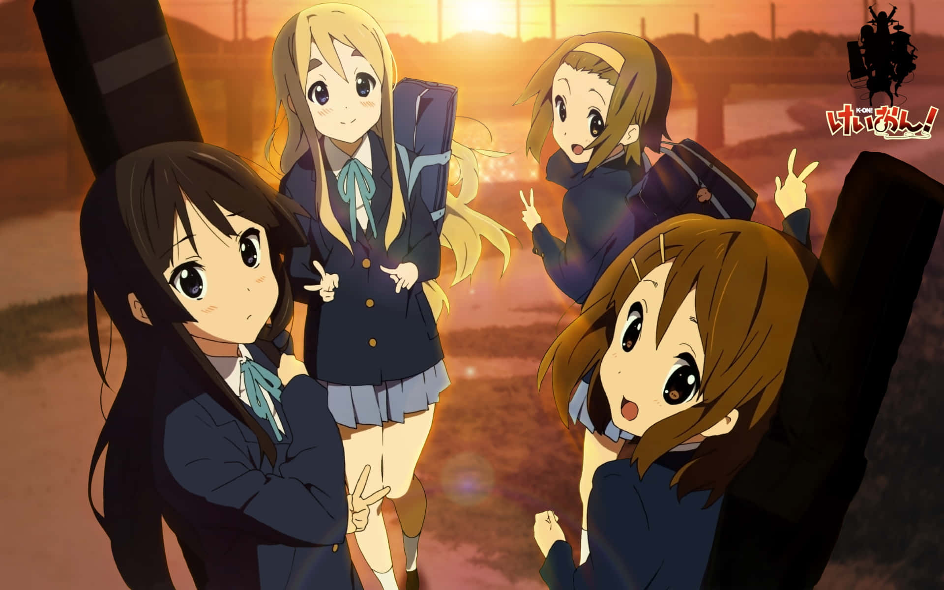 A Group Of Girls In Uniform Standing In Front Of A Sunset