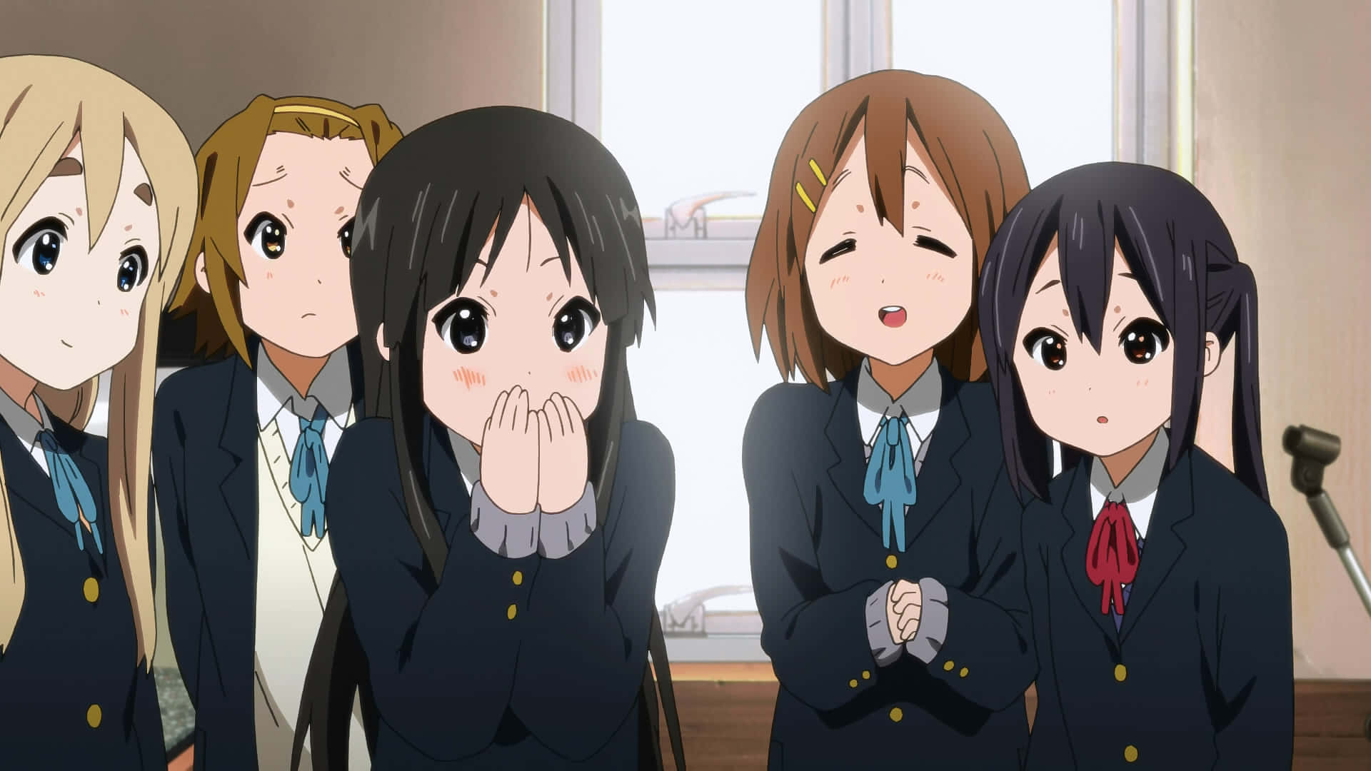 A Group Of Anime Girls In Uniforms Standing In Front Of A Microphone