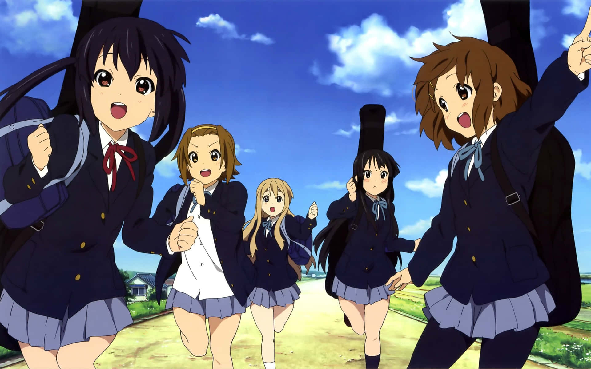 A Group Of Girls In School Uniforms Walking Down A Road
