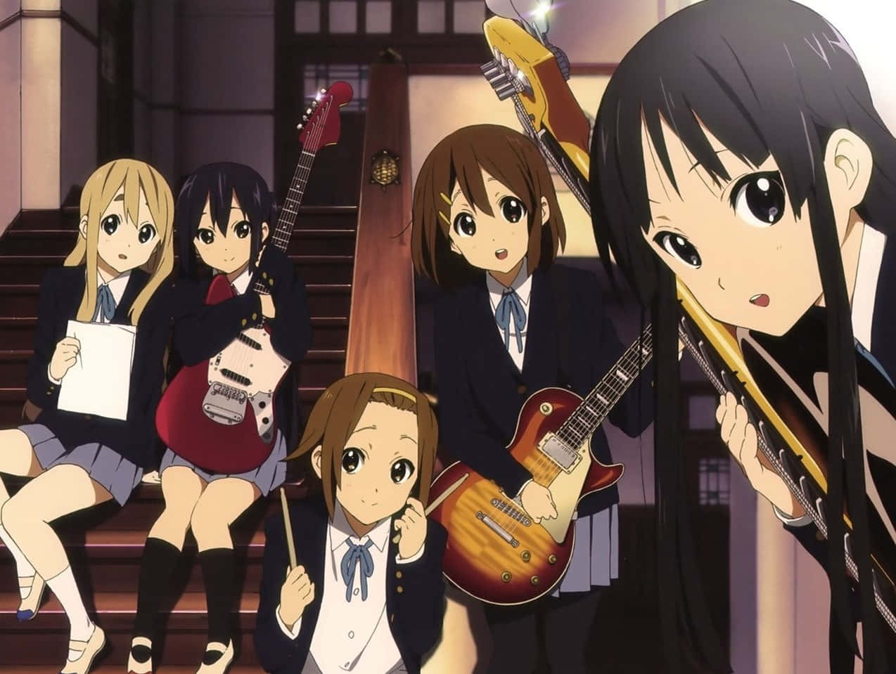 A Group Of Girls In School Uniforms Playing Guitars
