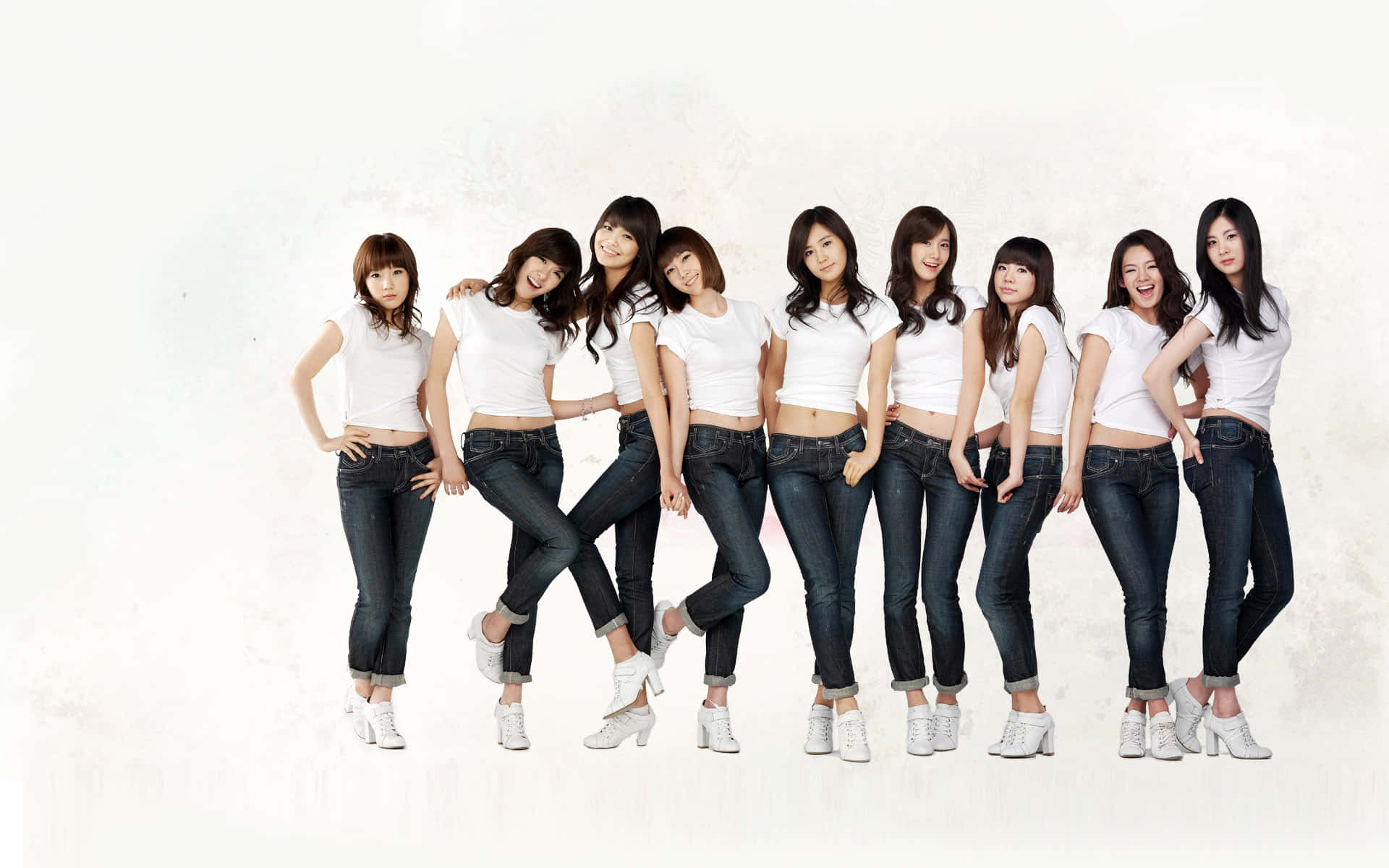 K Pop_ Group_ Posing_in_ White_ Tops_and_ Jeans Wallpaper