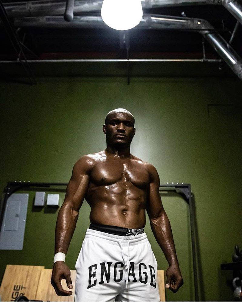 Caption: MMA Champion Kamaru Usman in Engage Fightwear Wallpaper