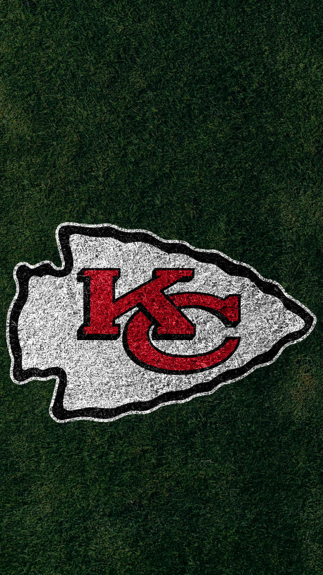 Kansascity Chiefs-logotypen På Gräset. Wallpaper