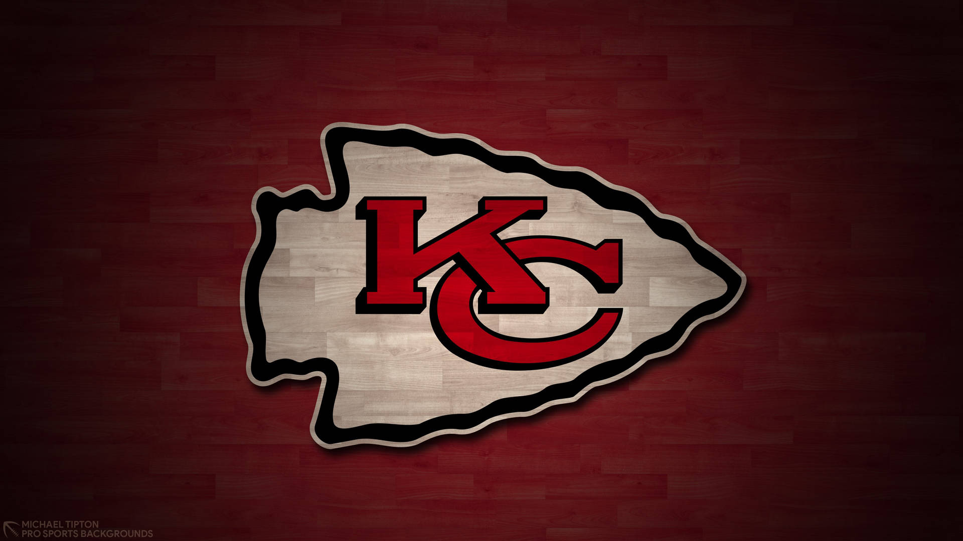 Caption: Redwood Kansas City Chiefs Logo Wallpaper