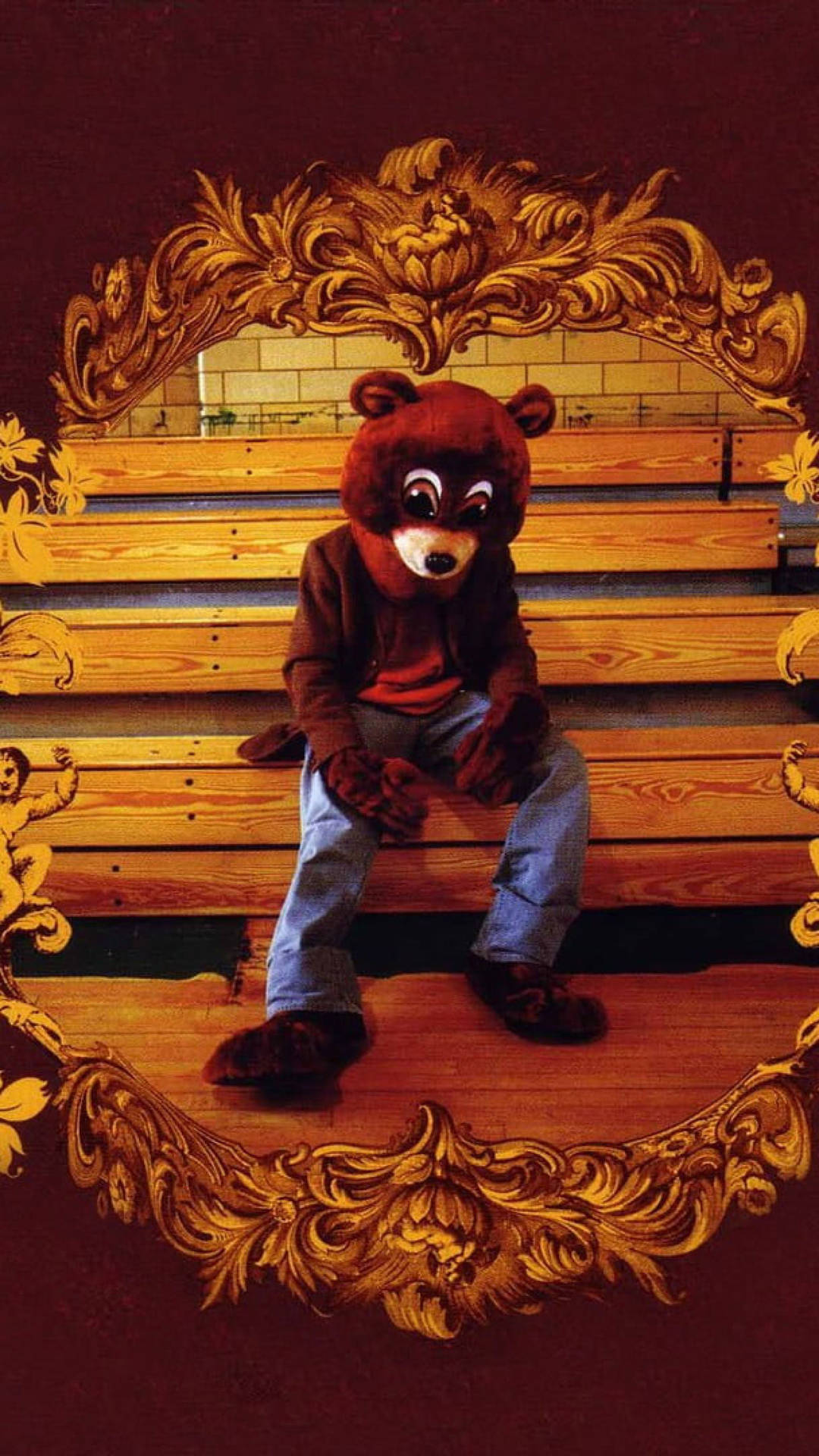 Kanye West Bear Mascot Costume On Bleachers Background