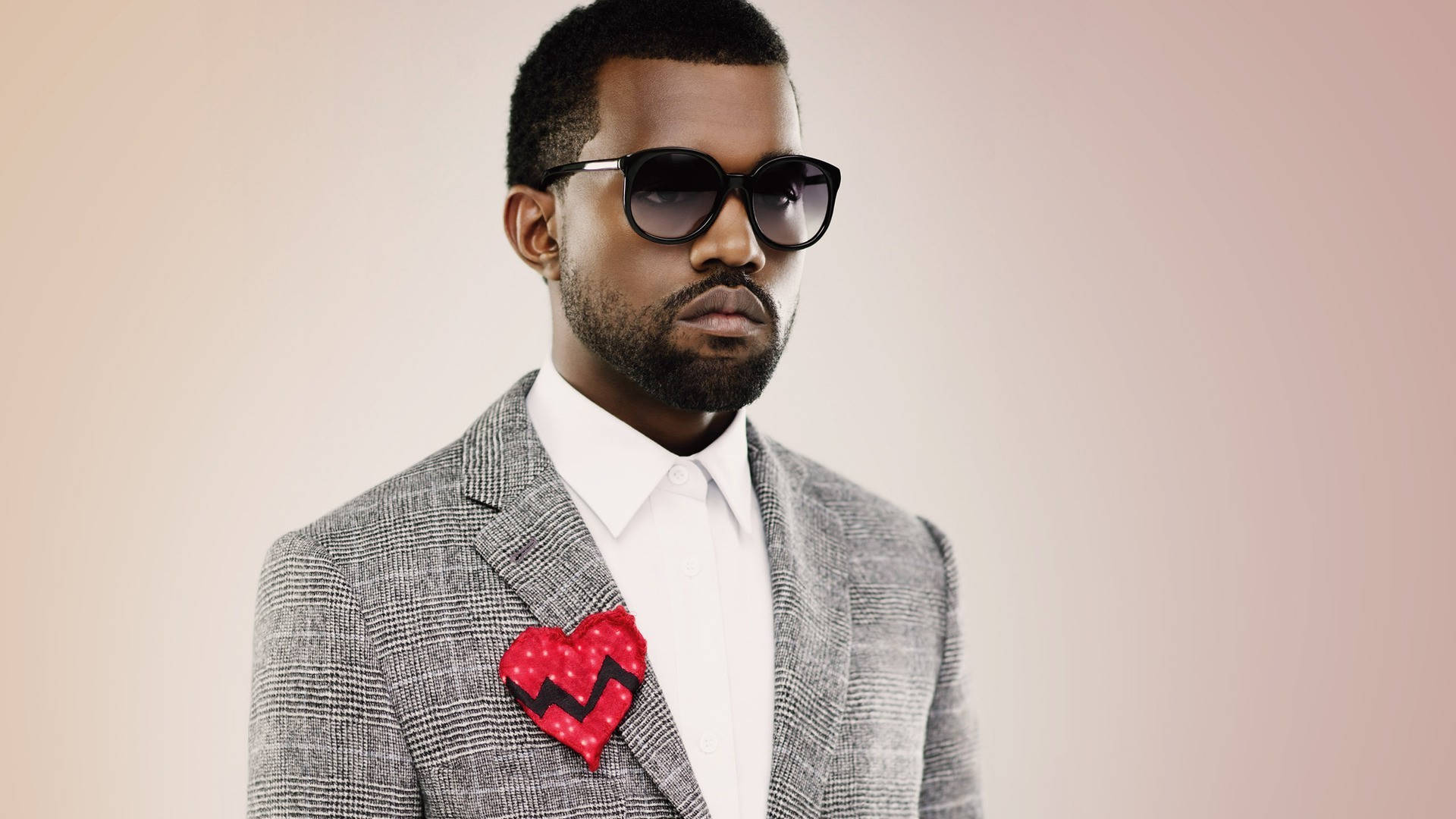 Kanye West In Grey Suit Wallpaper