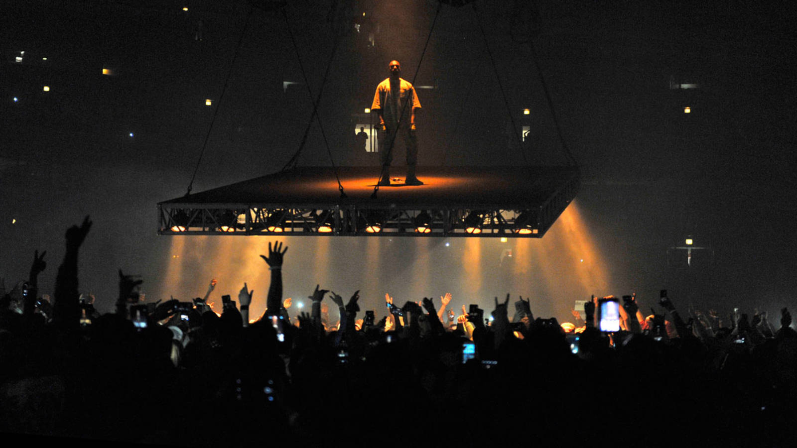 Kanye West Saint Pablo Standing Over Crowds Background