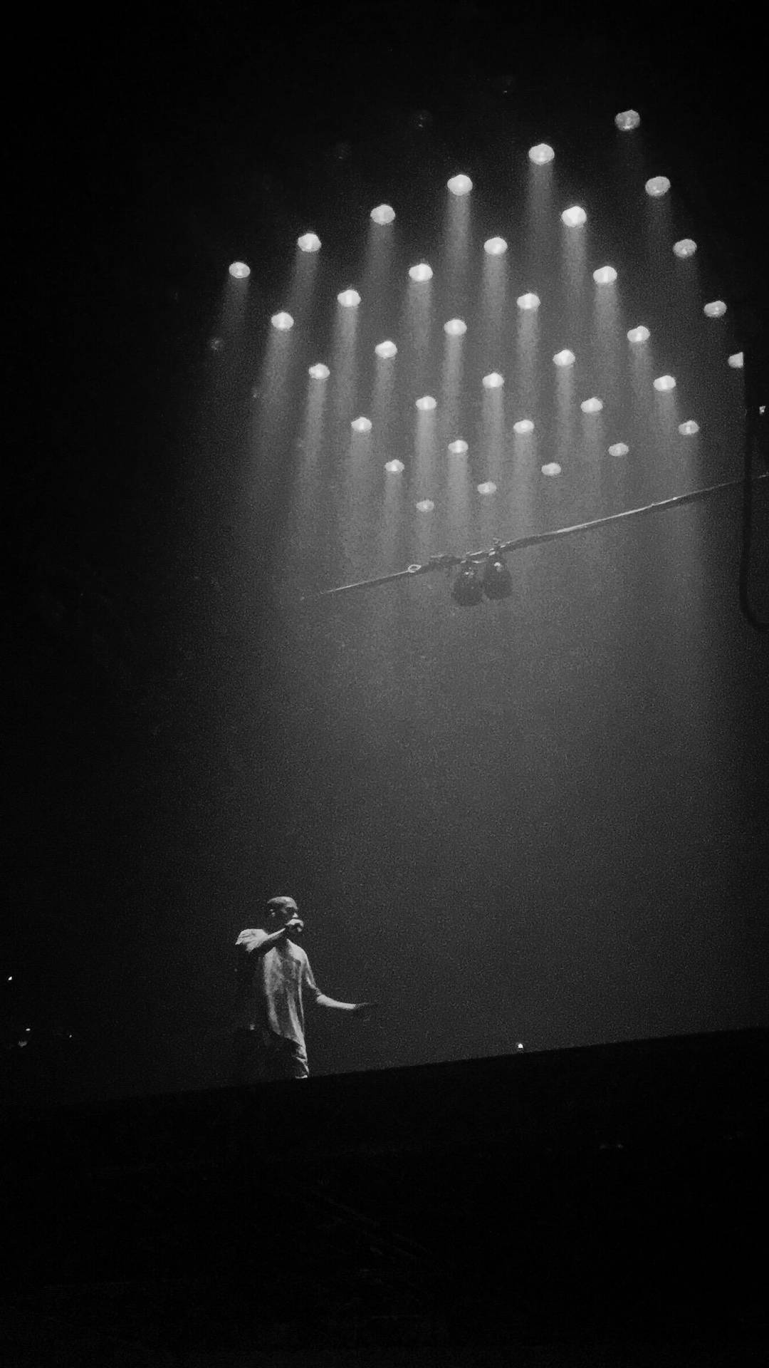 Kanye West Under Clustered Lights Background