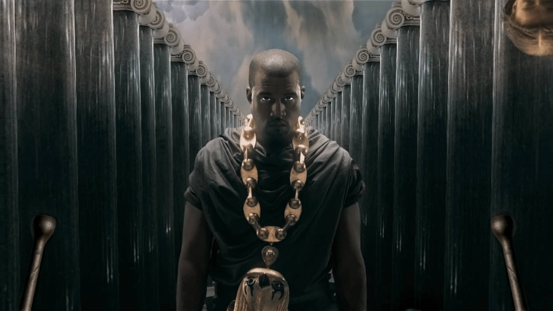 Kanye West With Oversized Gold Necklace Background